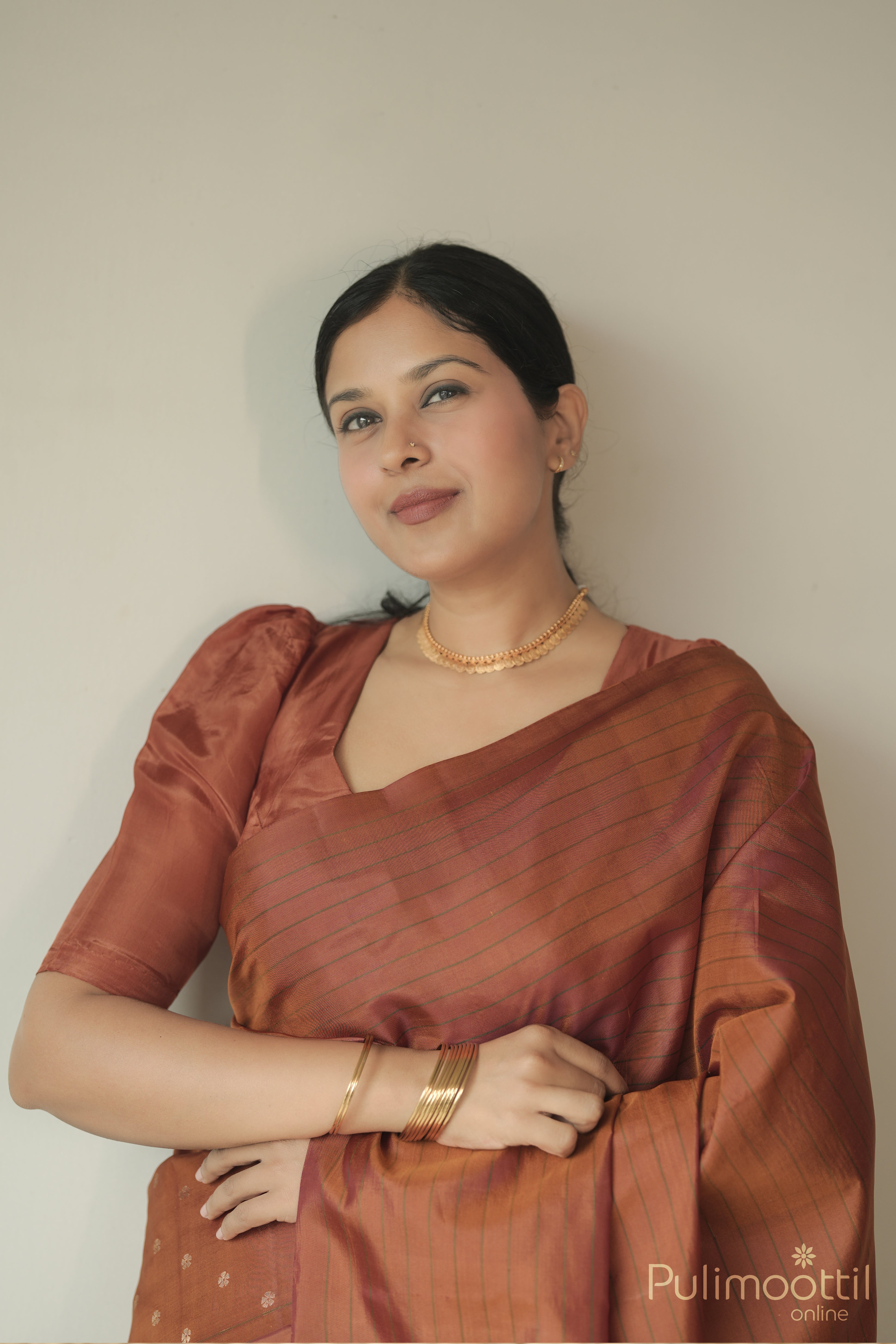 Kanchipuram Brick Shade Saree.