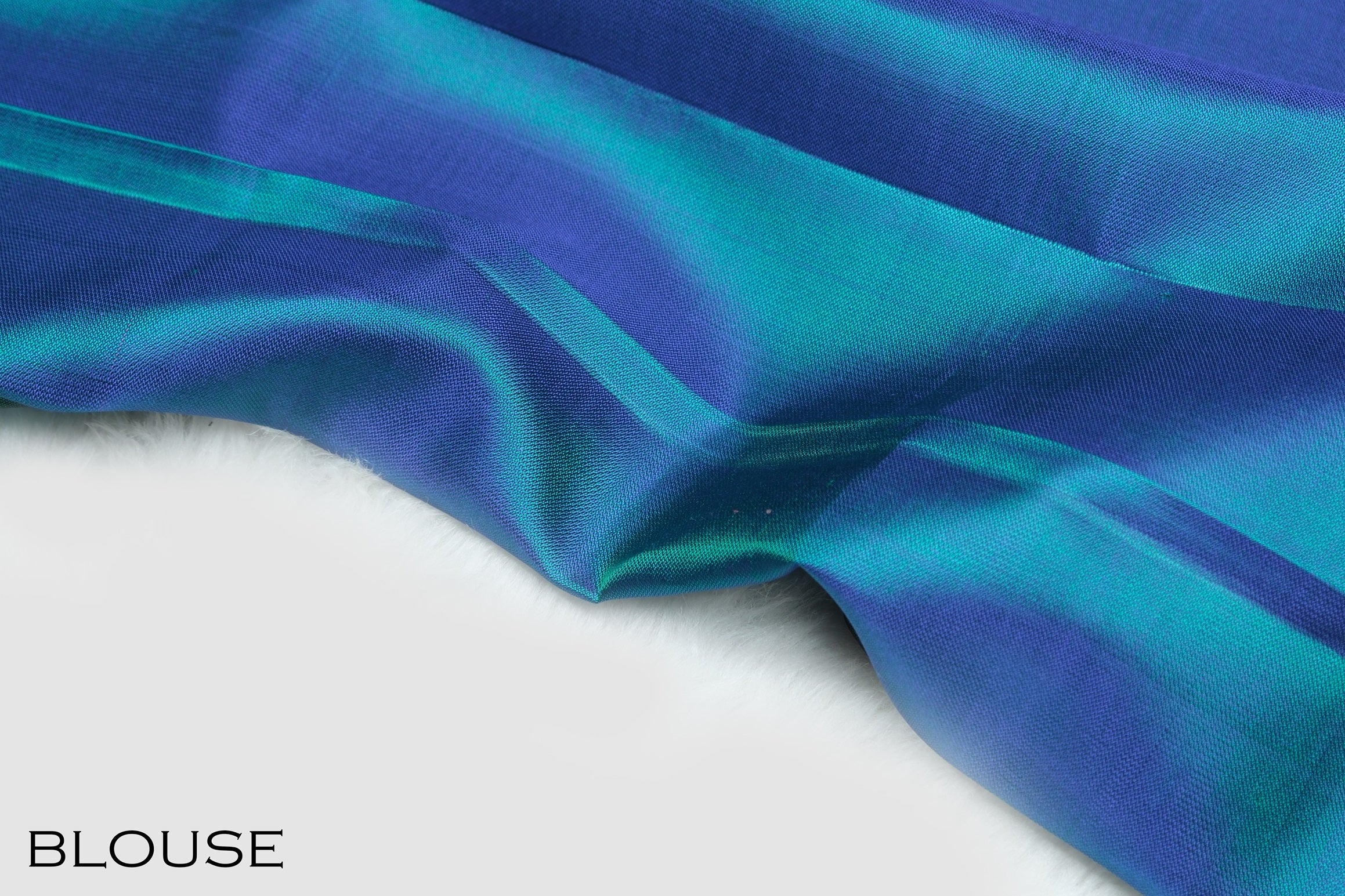 Peacock color pure Kanchipuram silk saree.