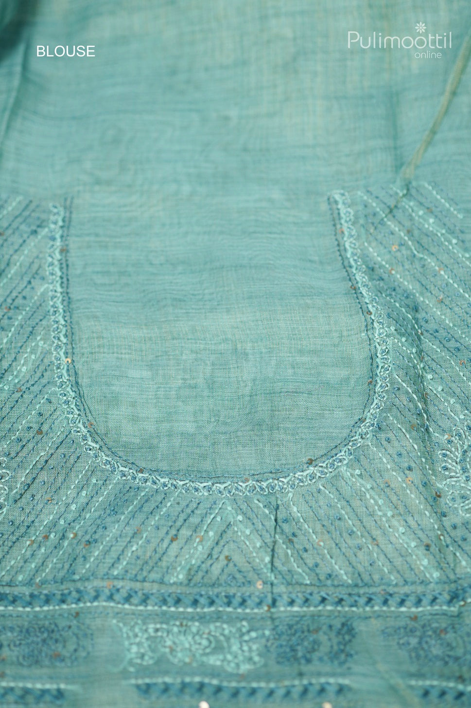 Light teal green-colored hand-embroidered semi linen saree
