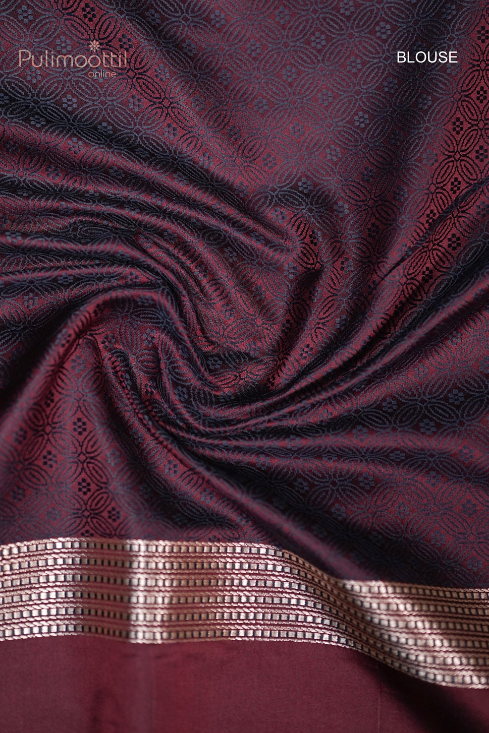 Contrast brocade blouse piece with self print and border, complementing the maroon Mashru silk Banarasi wedding saree from Pulimoottil Silks.