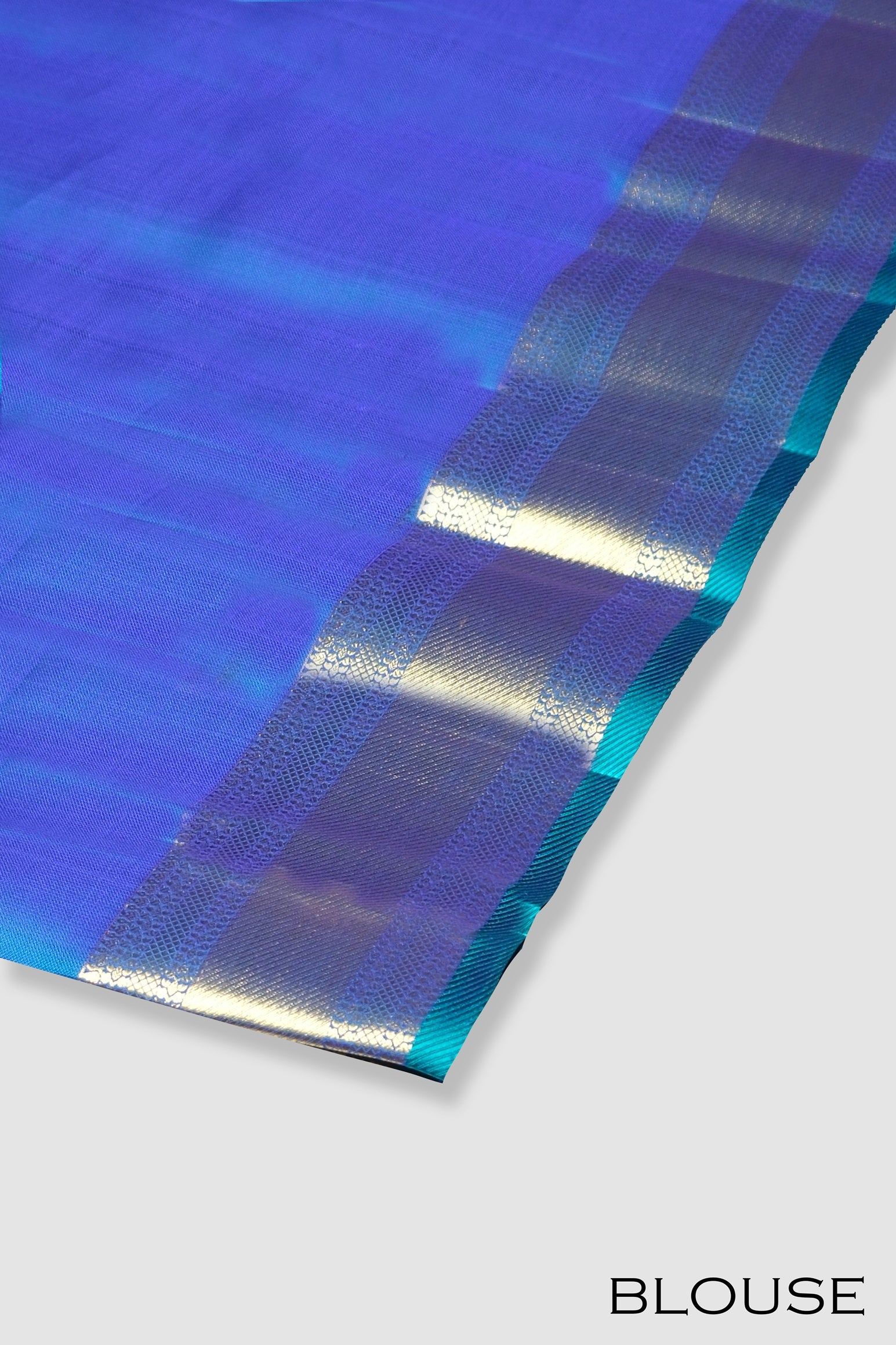 Peacock color pure Kanchipuram silk saree.
