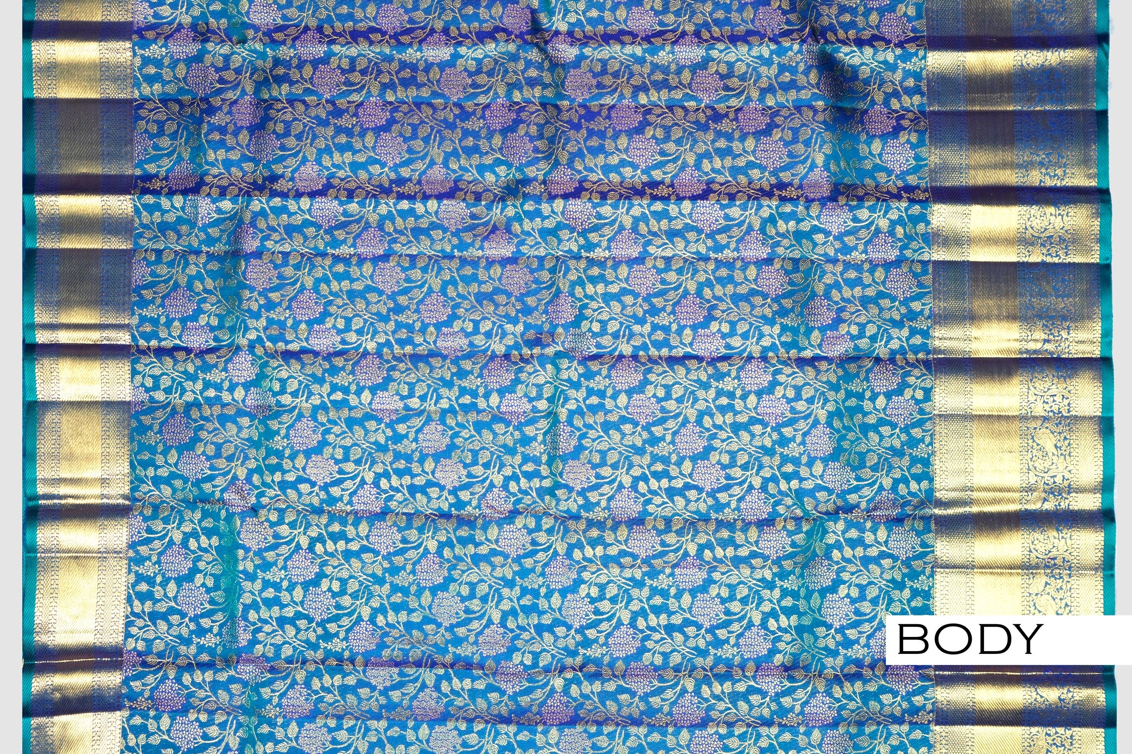 Peacock color pure Kanchipuram silk saree.