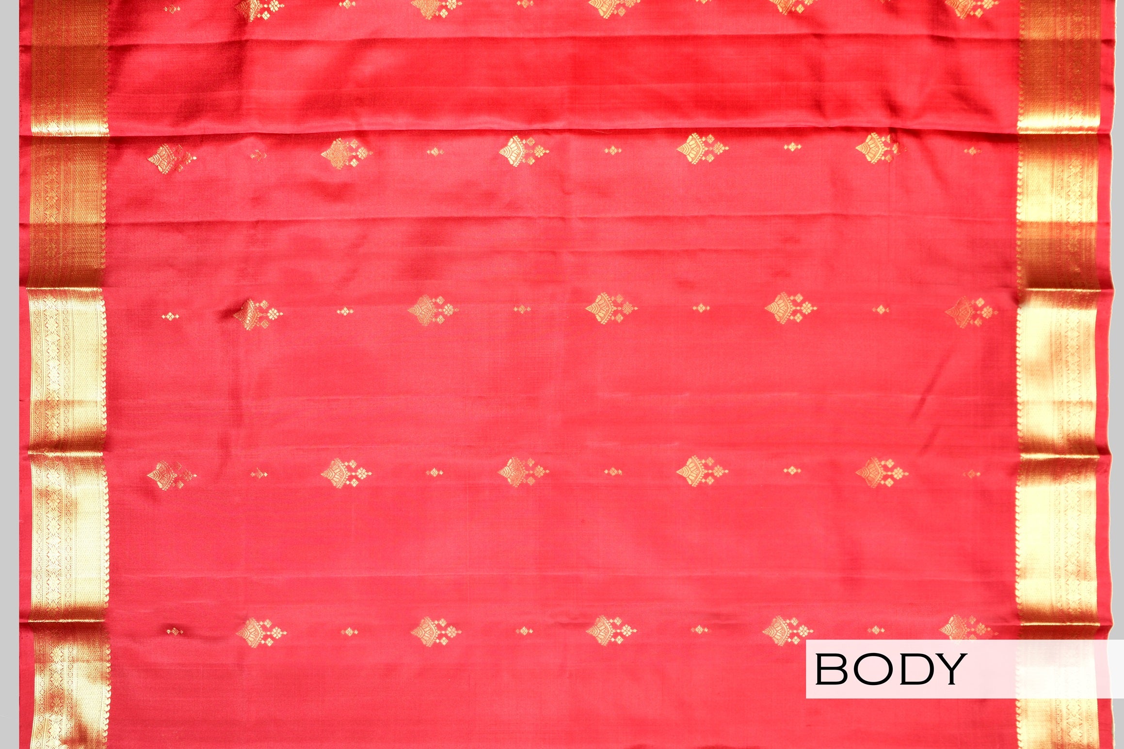 Red color pure Kanchipuram silk saree.