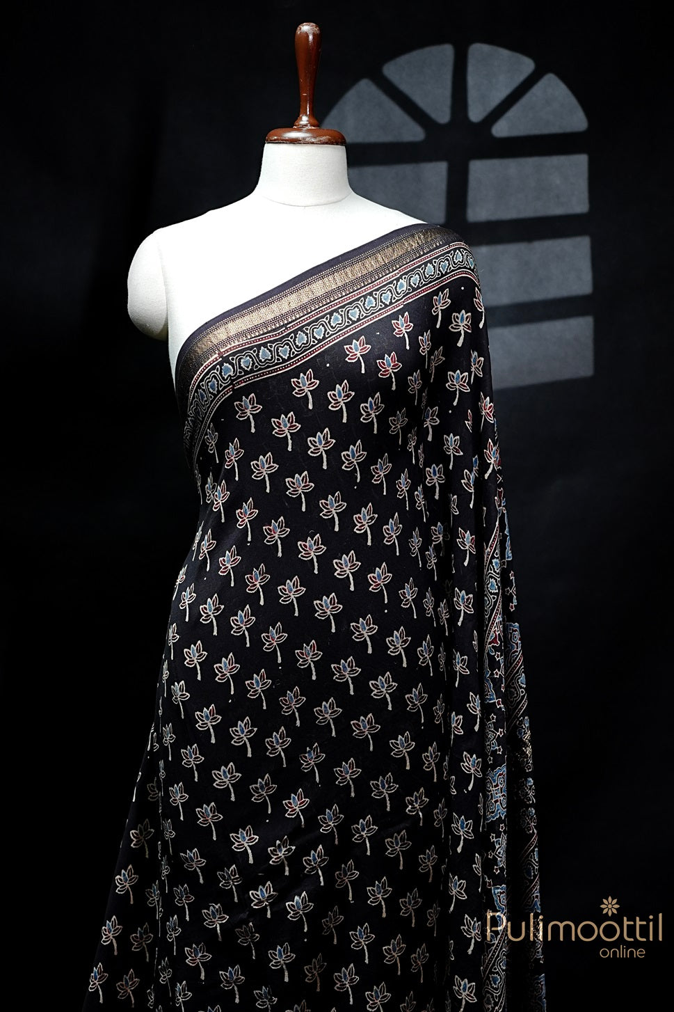 Black Colour Chandheri Silk Saree with floral block print featuring vibrant flowers and intricate zari zig-zag border.