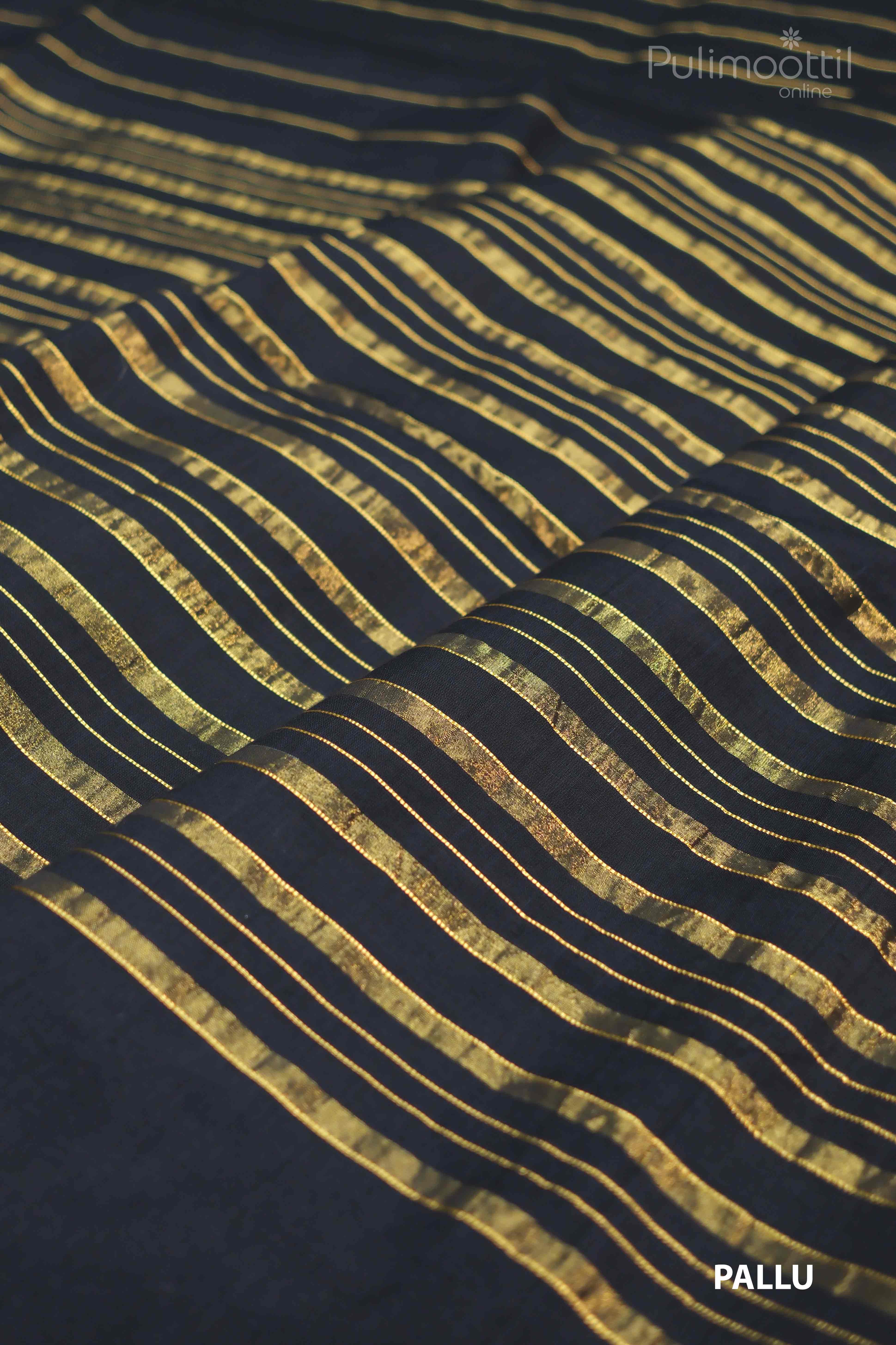 Black handloom cotton saree pallu draped over mannequin shoulder, gold horizontal stripes on body, no border.