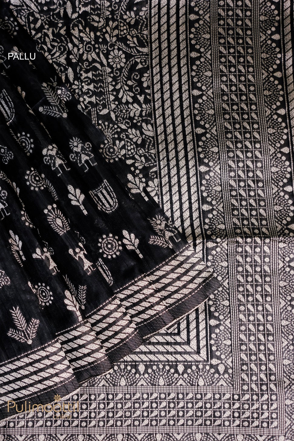 Close-up view of the black saree's silver tribal design with a striped border, featuring intricate geometric and floral patterns, perfect for a cultural and traditional look.