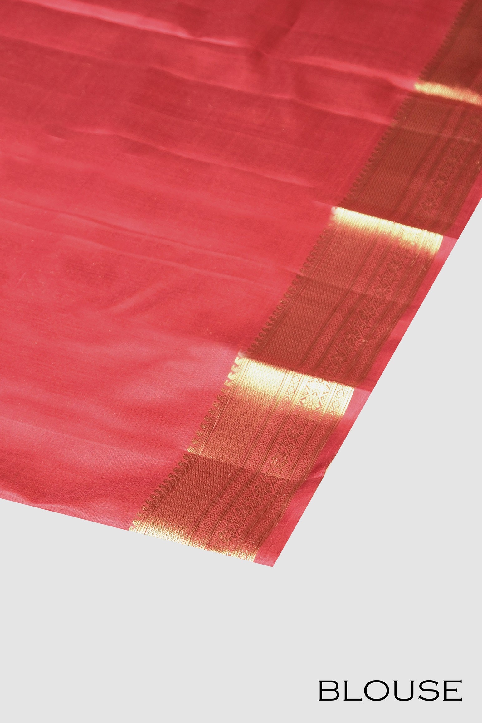 Red color pure Kanchipuram silk saree.