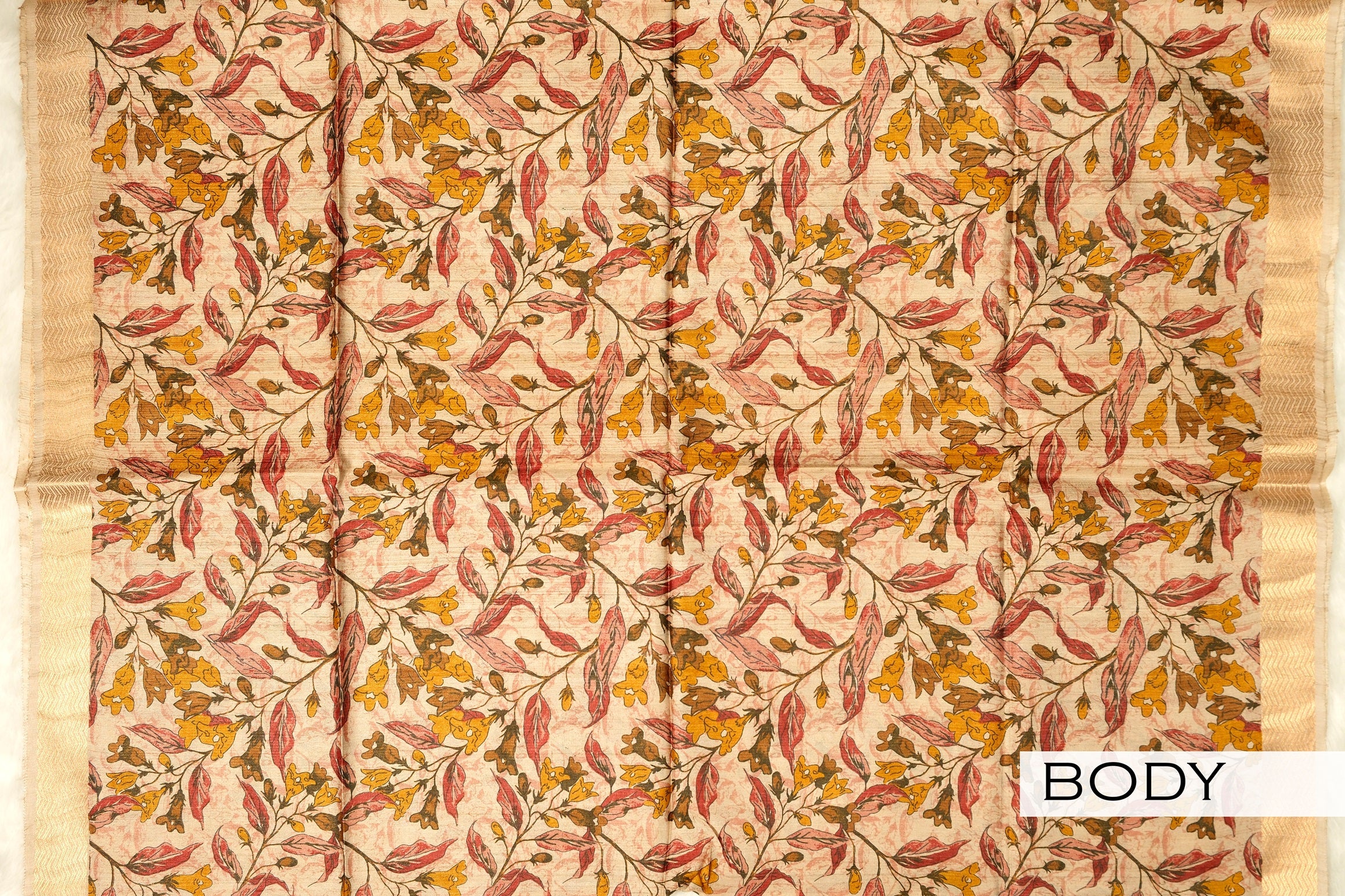 Beige color floral printed jute silk saree.