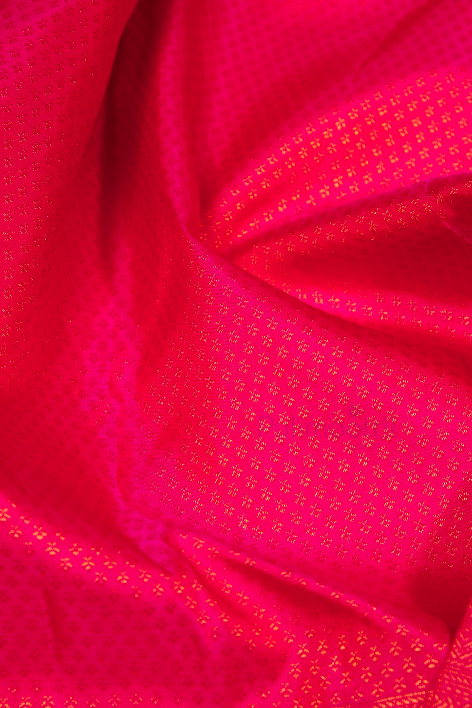 Matching blouse piece in ripe plum silk with gold zari square pattern for bridal Kanchipuram saree.