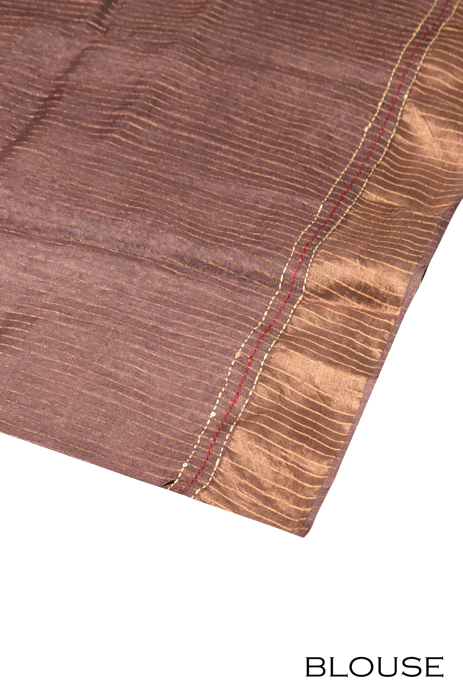 Traditional blouse fabric design with matching motifs and color tones, complementing the saree ensemble.