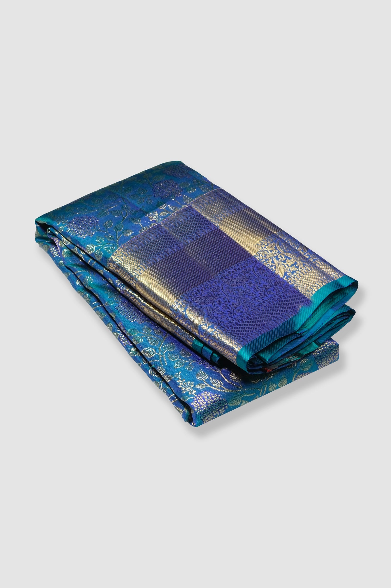 Peacock color pure Kanchipuram silk saree.