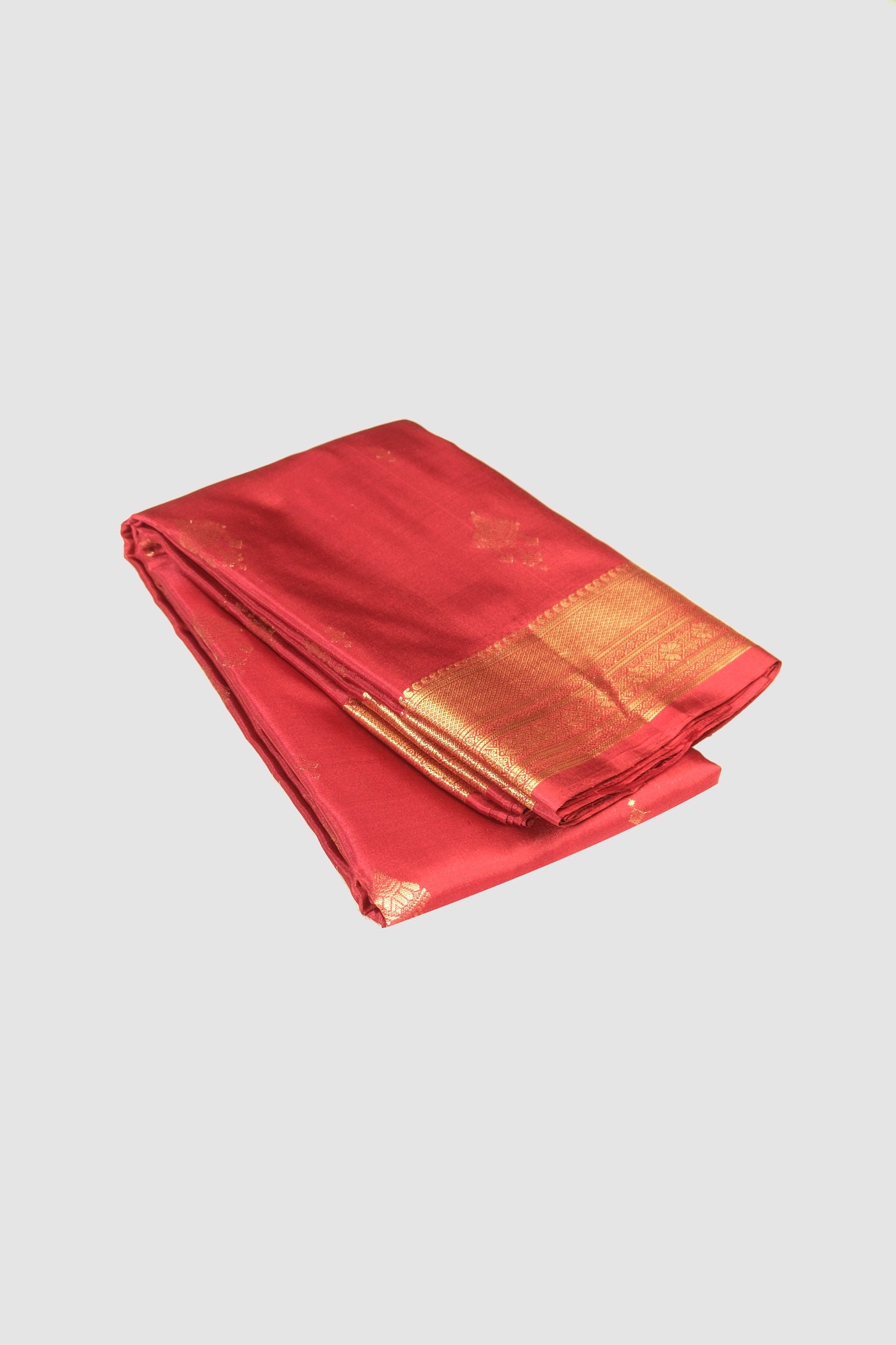 Red color pure Kanchipuram silk saree.