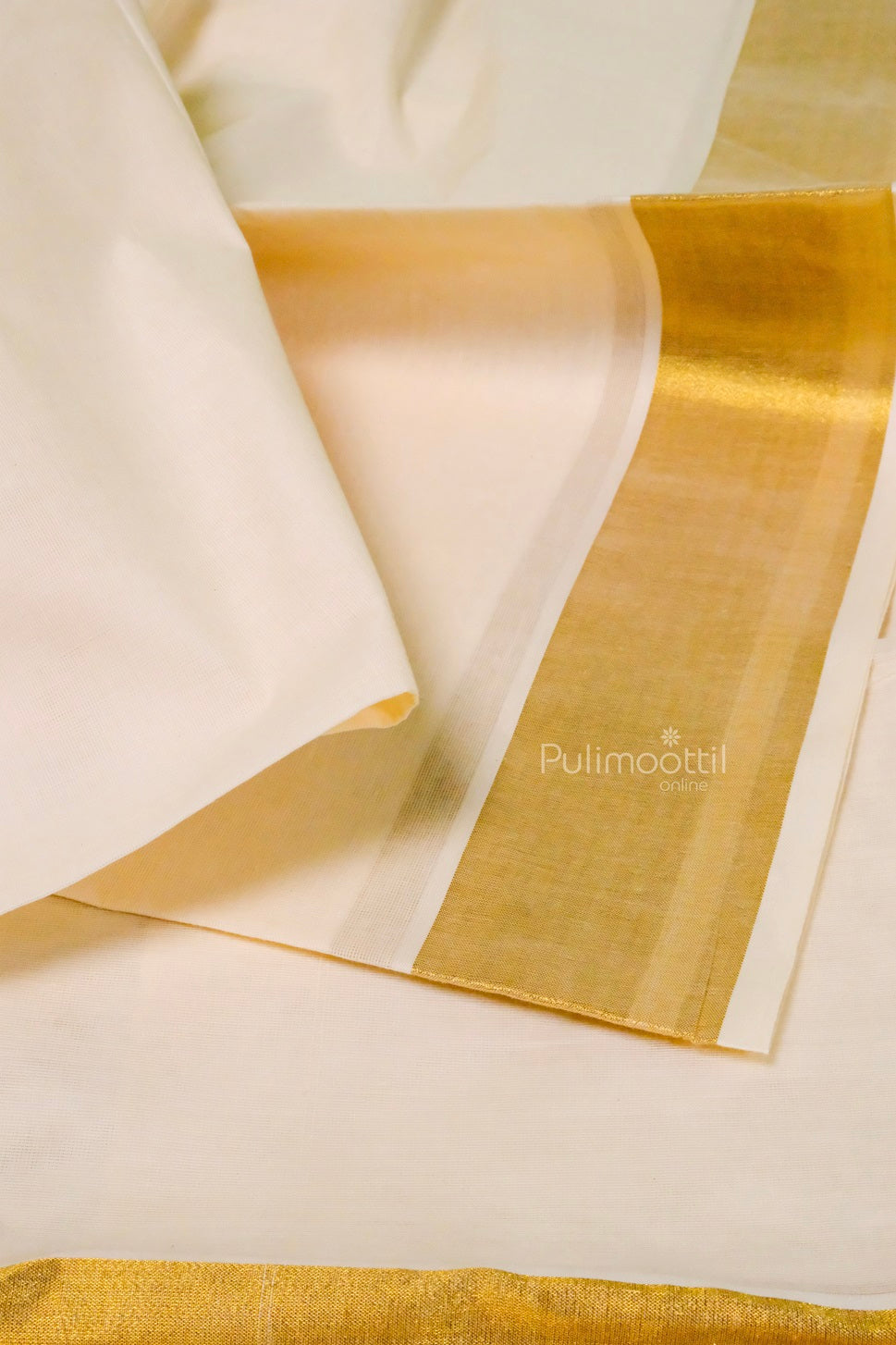 Elegant cream Kerala saree with golden zari border, neatly folded with pink and white flowers on a burlap background