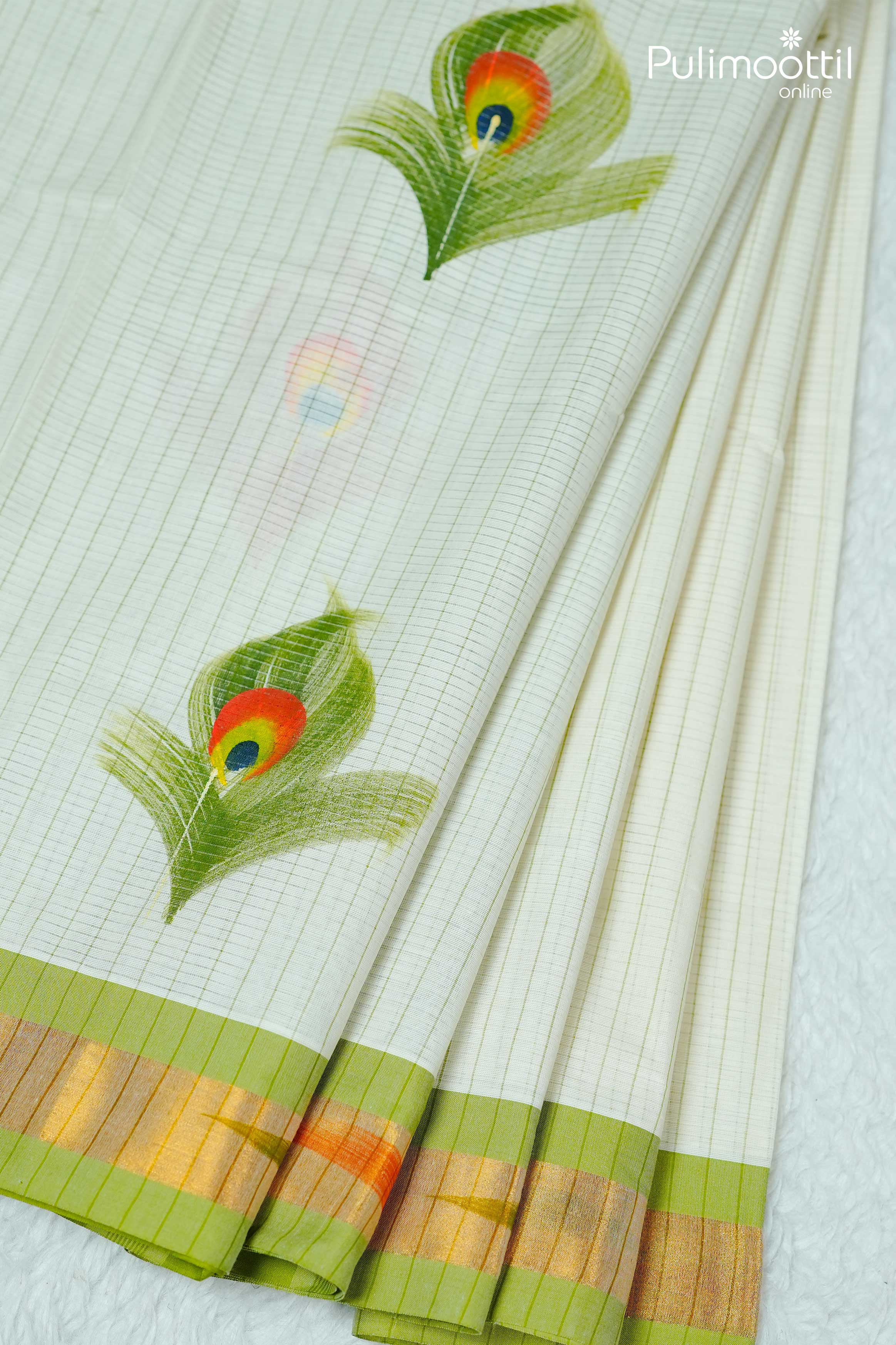 Cream Kerala traditional set saree with golden tissue border and hand-painted peacock feather motifs on pleats.