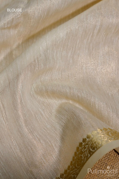 Cream colour net cotta blouse fabric with smooth texture and elegant golden zari border, matching the saree design.