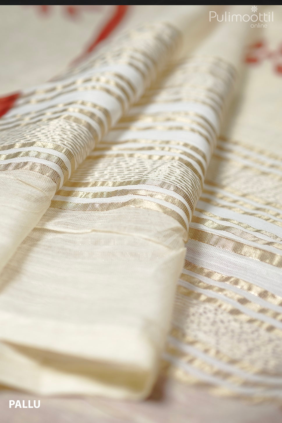 Close-up of cream net cotta saree pallu with elegant golden stripes and tassel detailing.