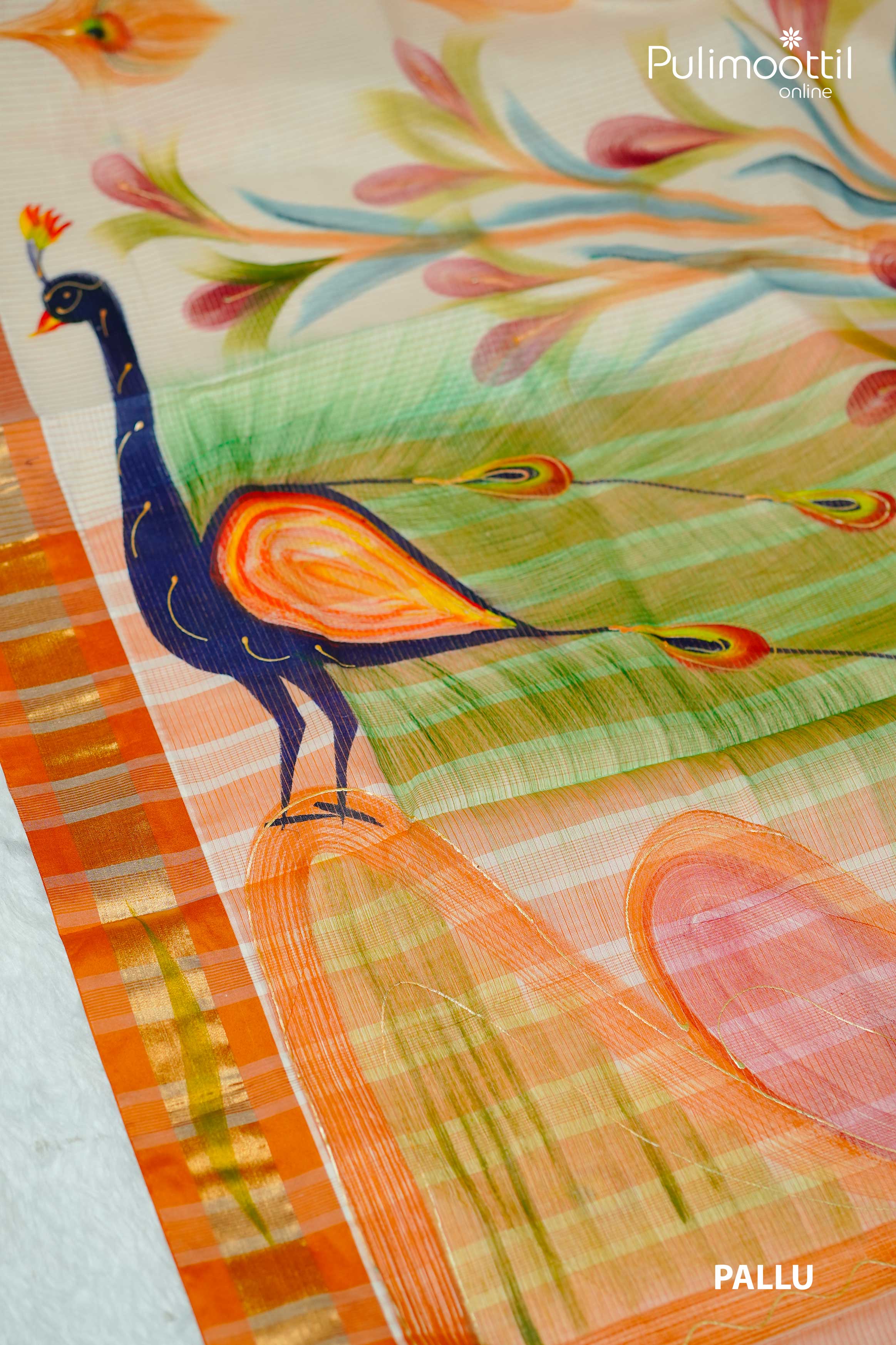 Close-up of Kerala tissue saree pallu featuring hand-painted style peacock and floral design with orange and gold checked border.