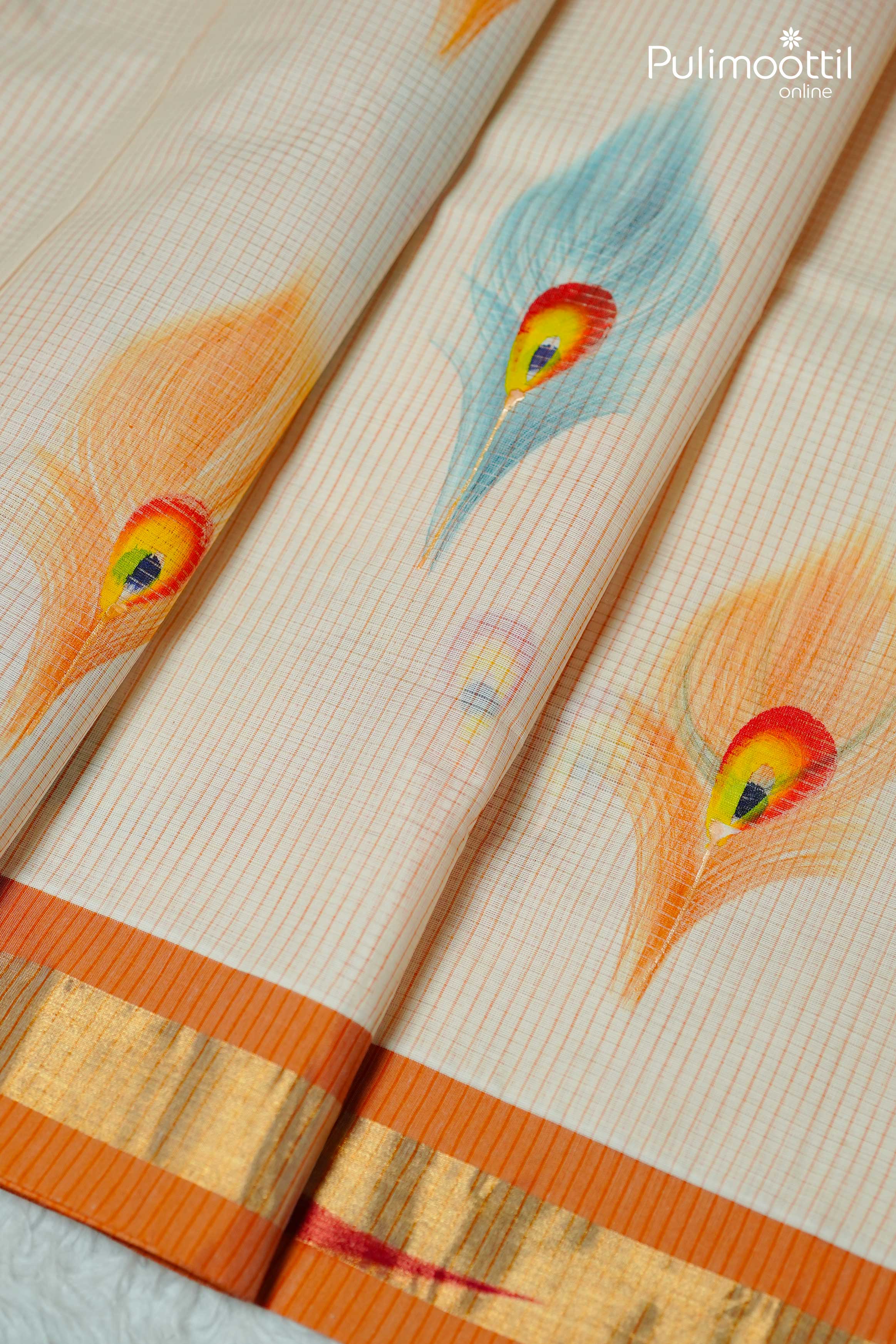 Kerala tissue saree with orange and gold zari border, decorated with multicolor peacock feather motifs on cream base.