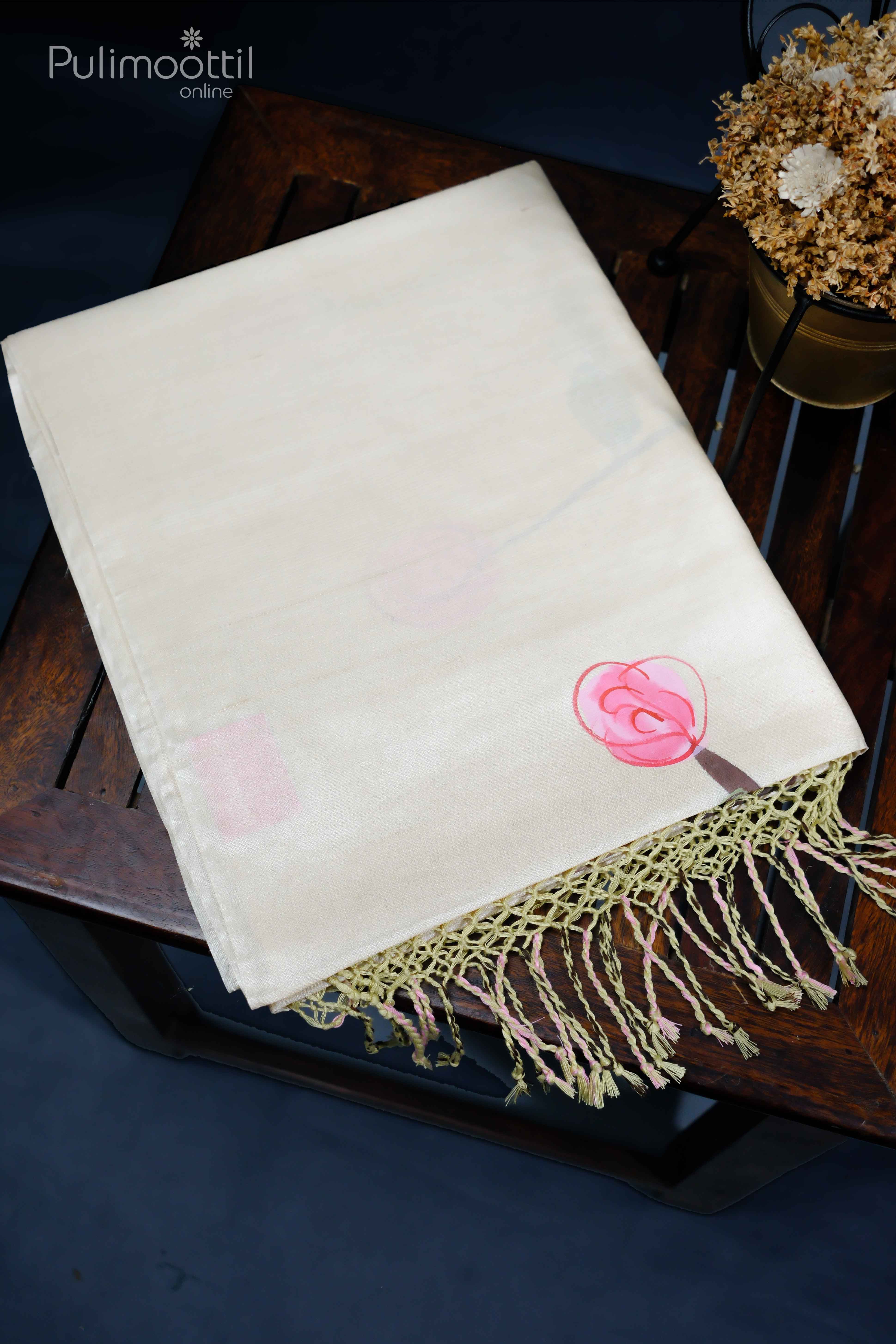 Folded Cream and Light Pista Green Pure Tussar Silk Saree with Floral Painting Design and Fringed Ends.