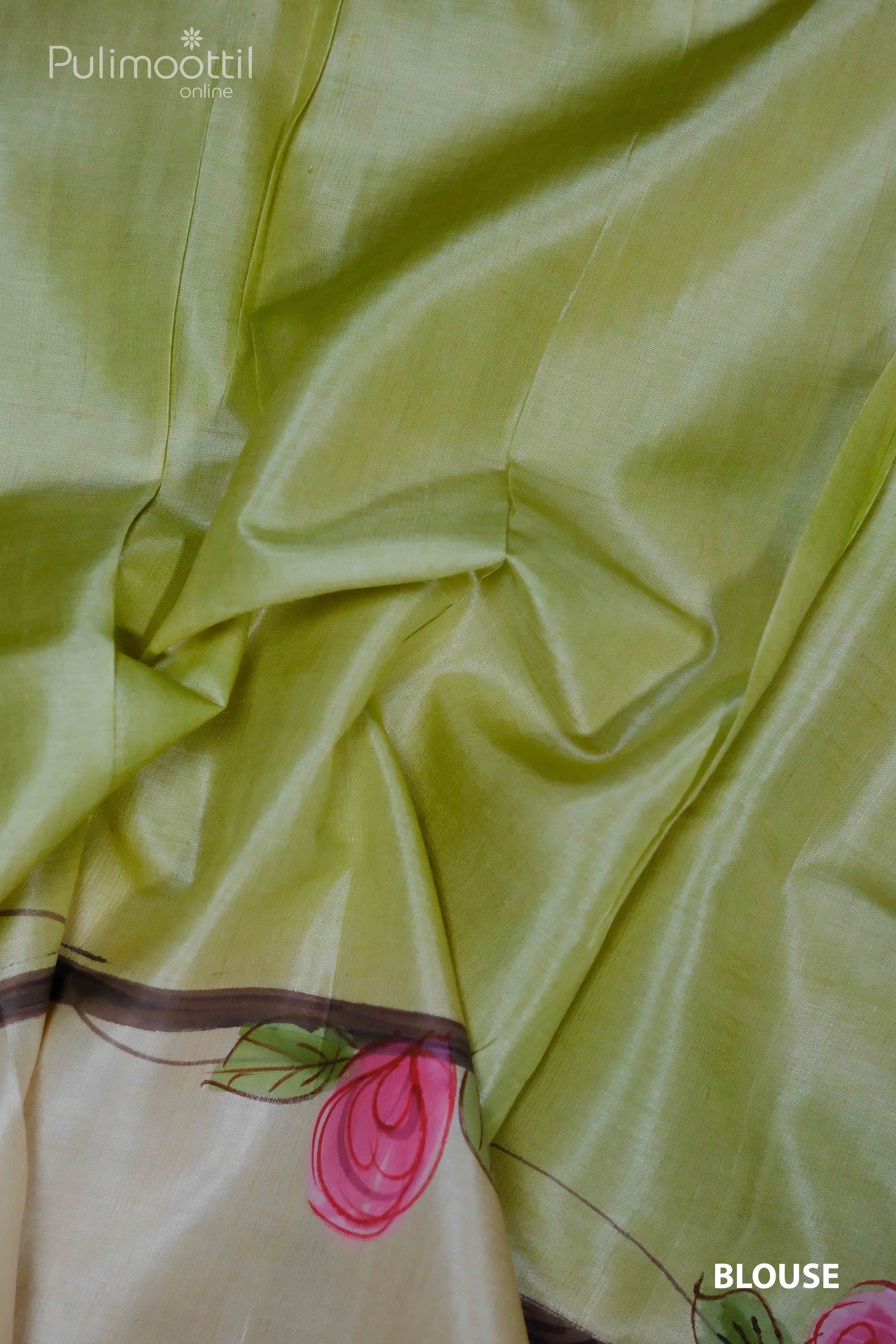 Close-up of Light Pista Green Blouse with Floral Design, Complementing the Cream and Light Pista Green Pure Tussar Silk Saree.