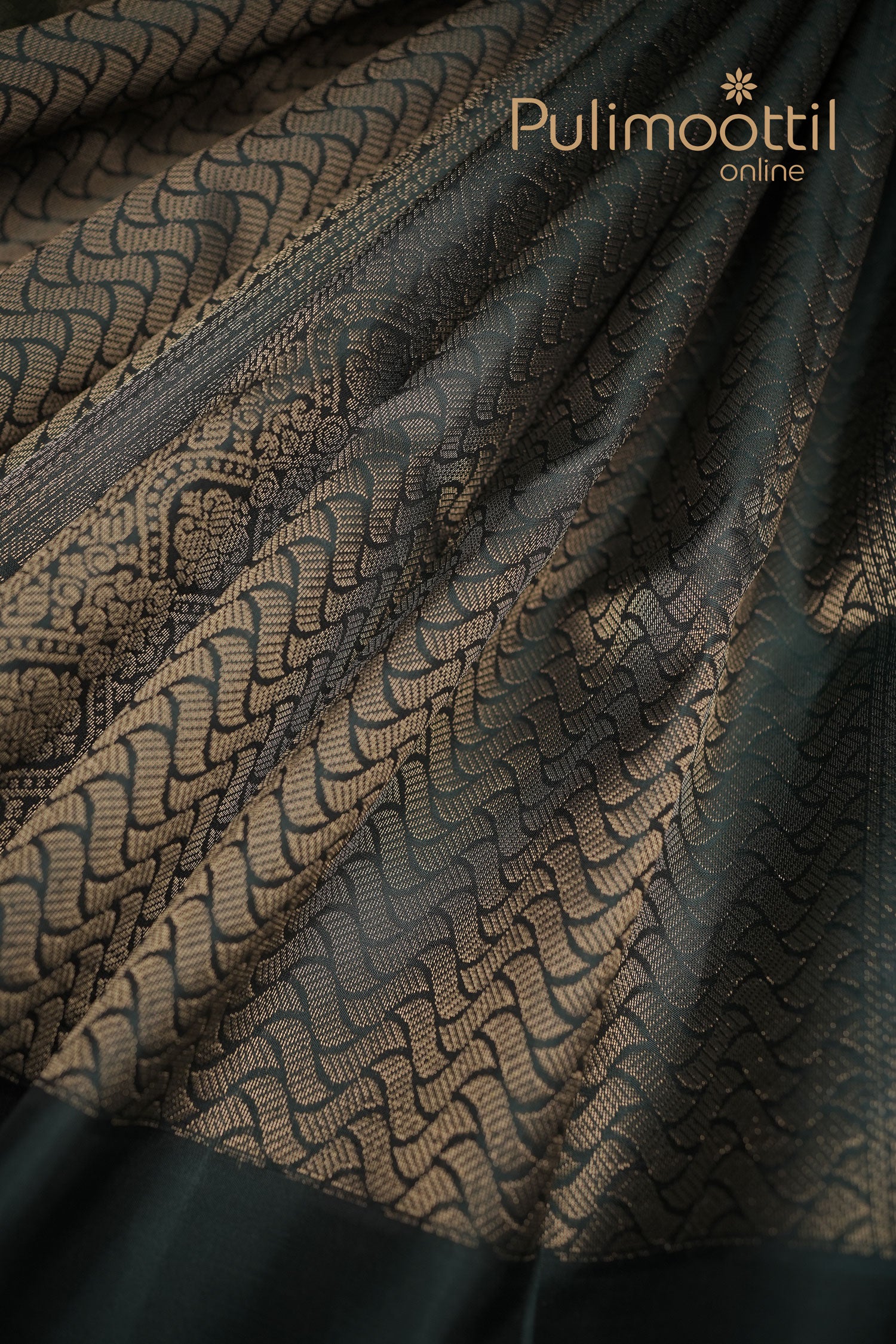 Crocodile green Kanchipuram silk saree with all-over gold zari waves and floral motifs, featuring a rich woven pallu and contrasting dark border.