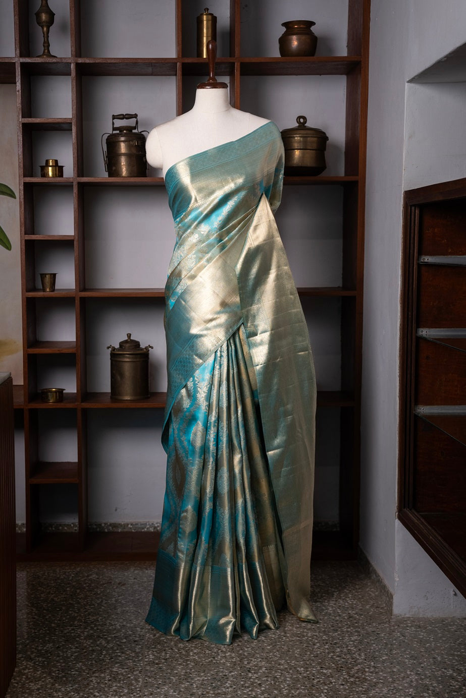 Teal blue color Kanchipuram saree.