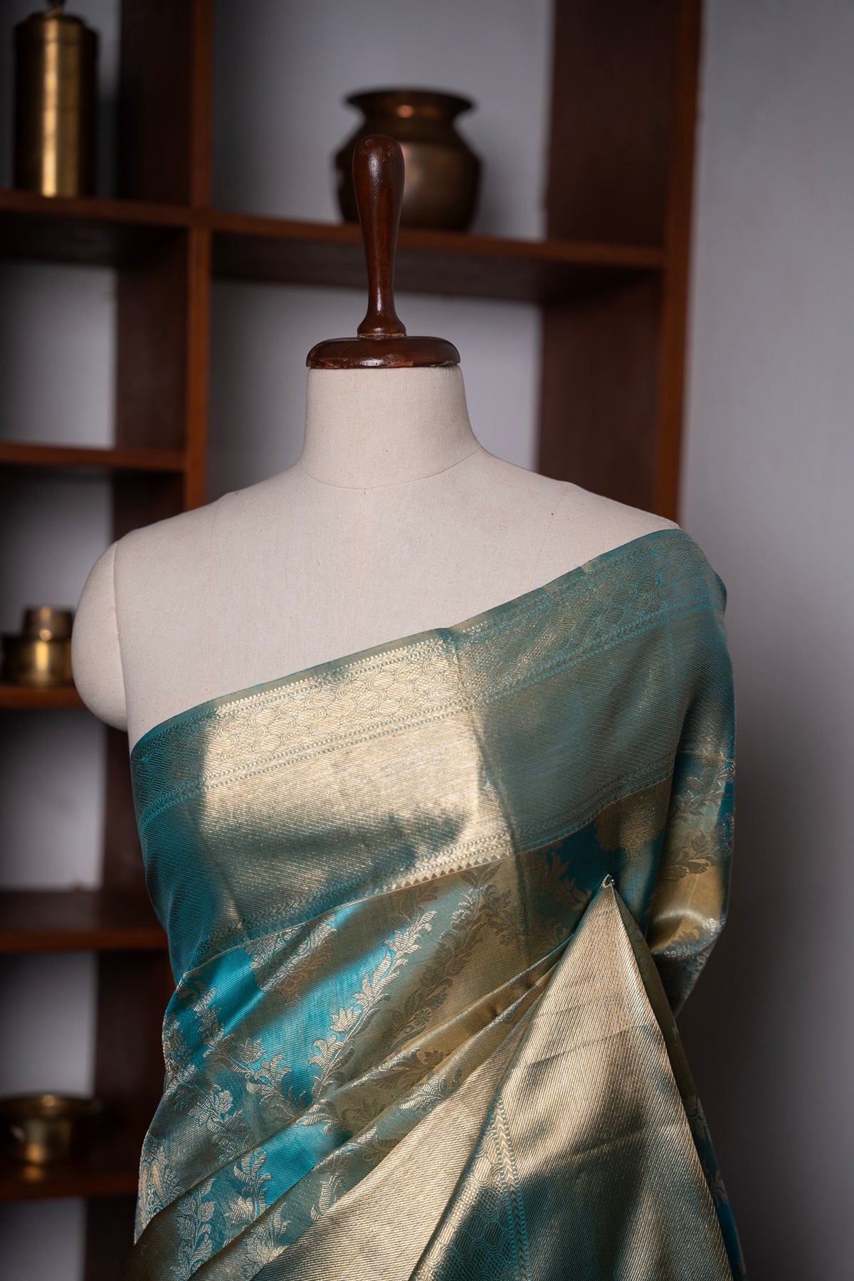 Teal blue color Kanchipuram saree.