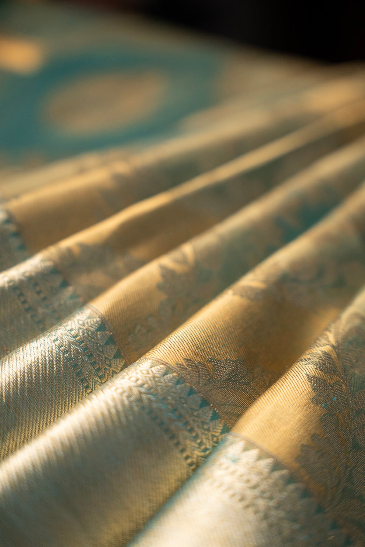 Teal blue color Kanchipuram saree.