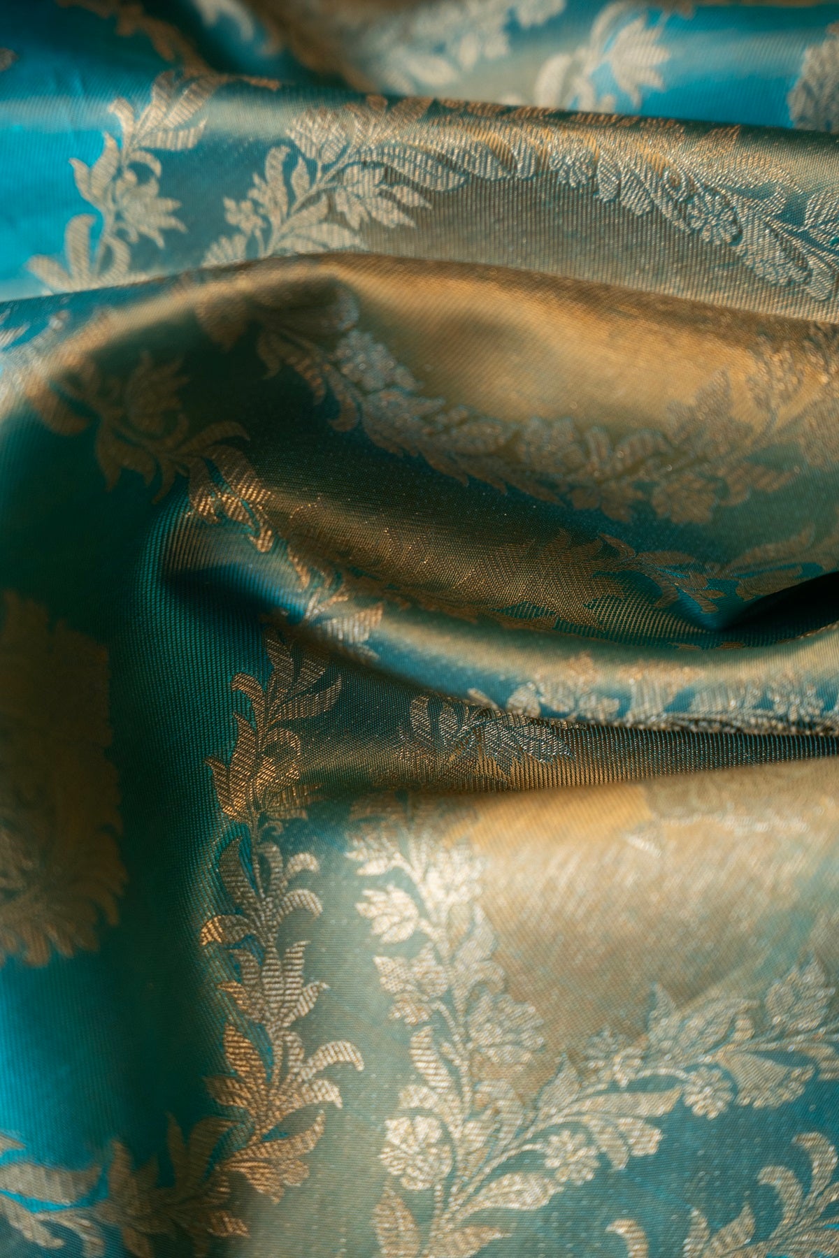 Teal blue color Kanchipuram saree.