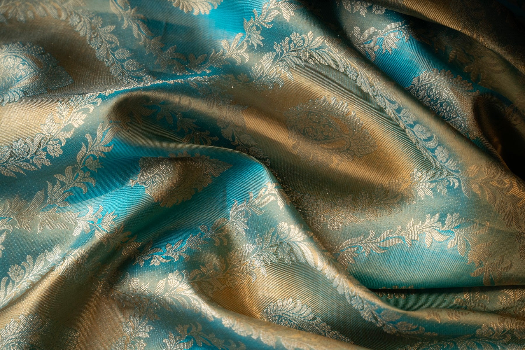Teal blue color Kanchipuram saree.