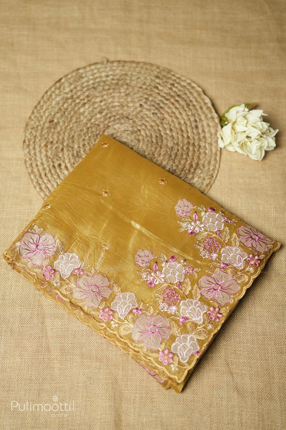 Caramel yellow-colored velvet organza appliqué work fancy saree.