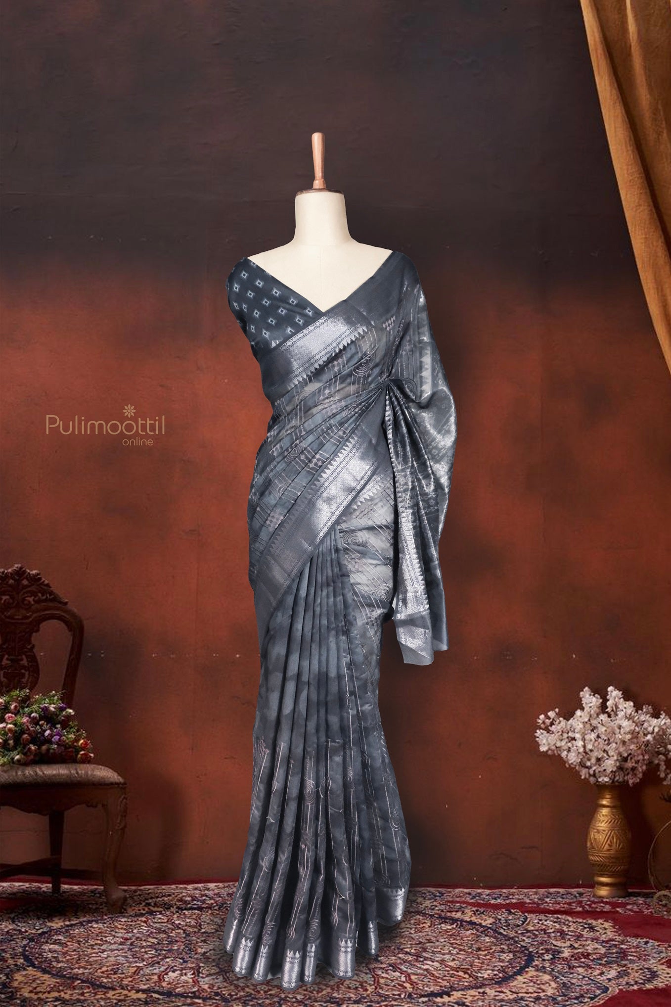 Likely a product flat lay or fold presentation. The saree is neatly arranged to highlight the border and pallu design. Good for e-commerce display.