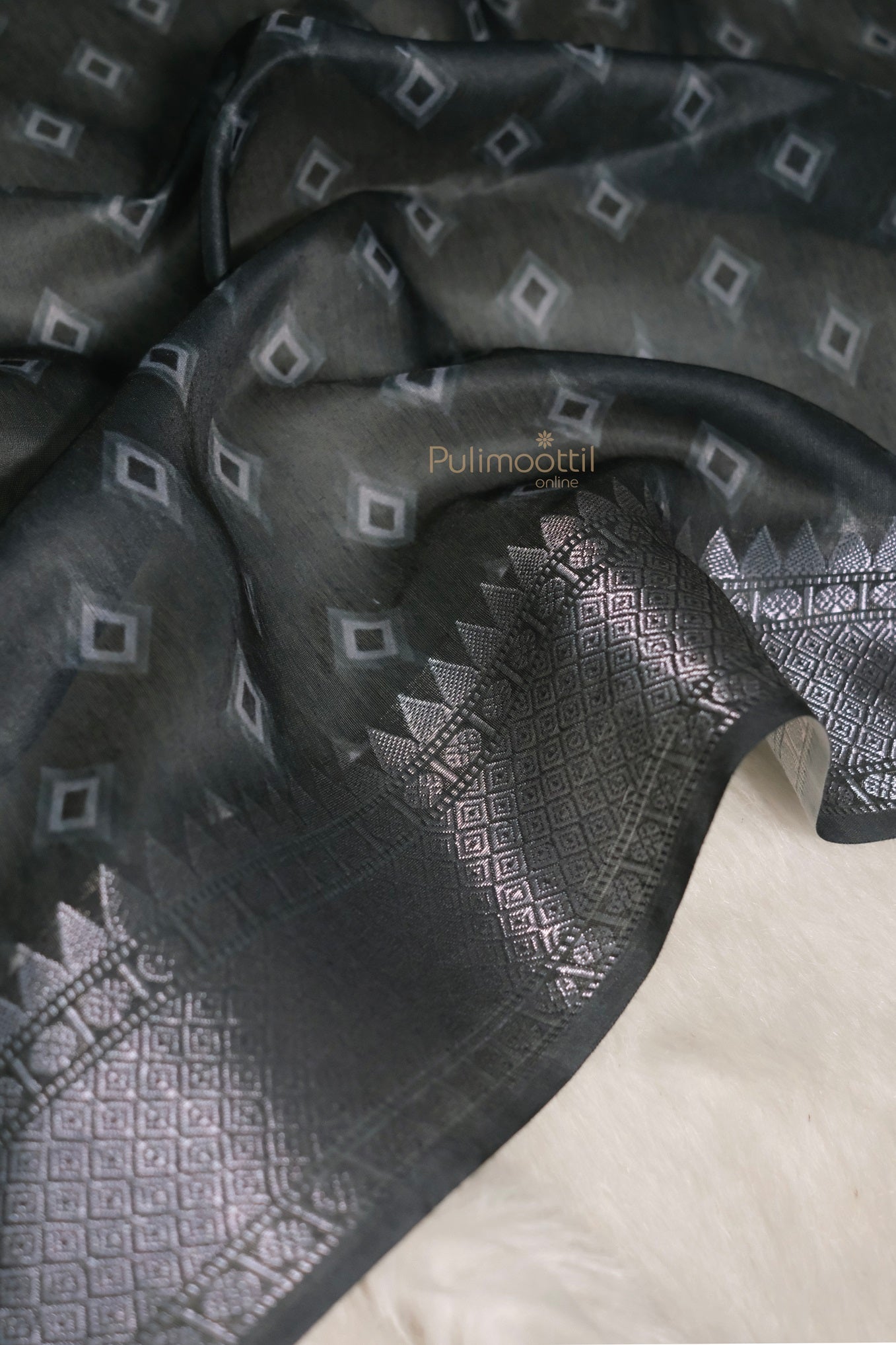 Another detailed view, possibly zoomed in on the zari work or texture. Highlights craftsmanship and fabric quality.