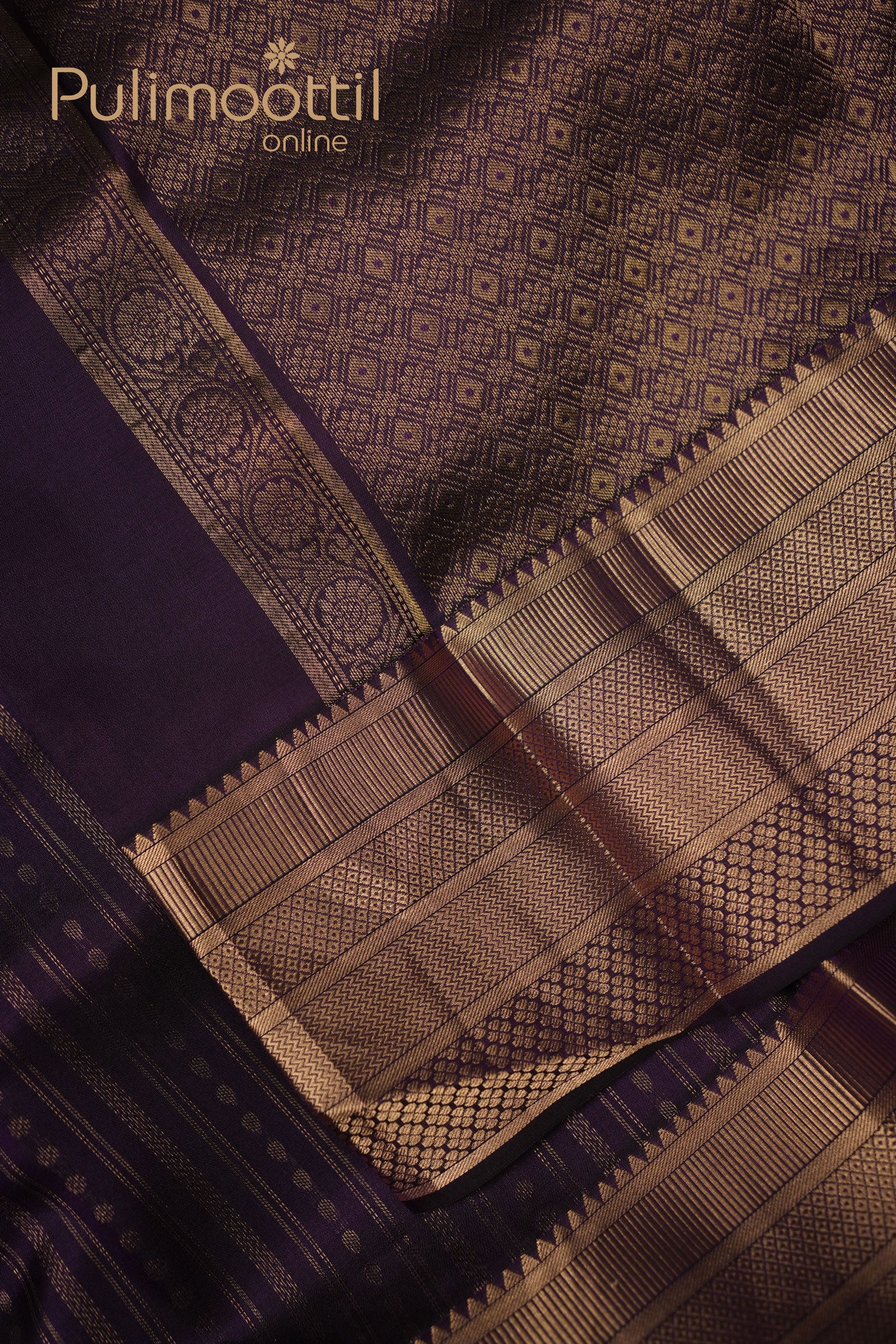 Dark purple Kanchipuram silk saree with fine golden zari stripes on the body and a rich golden zari butta border visible in intricate weave.