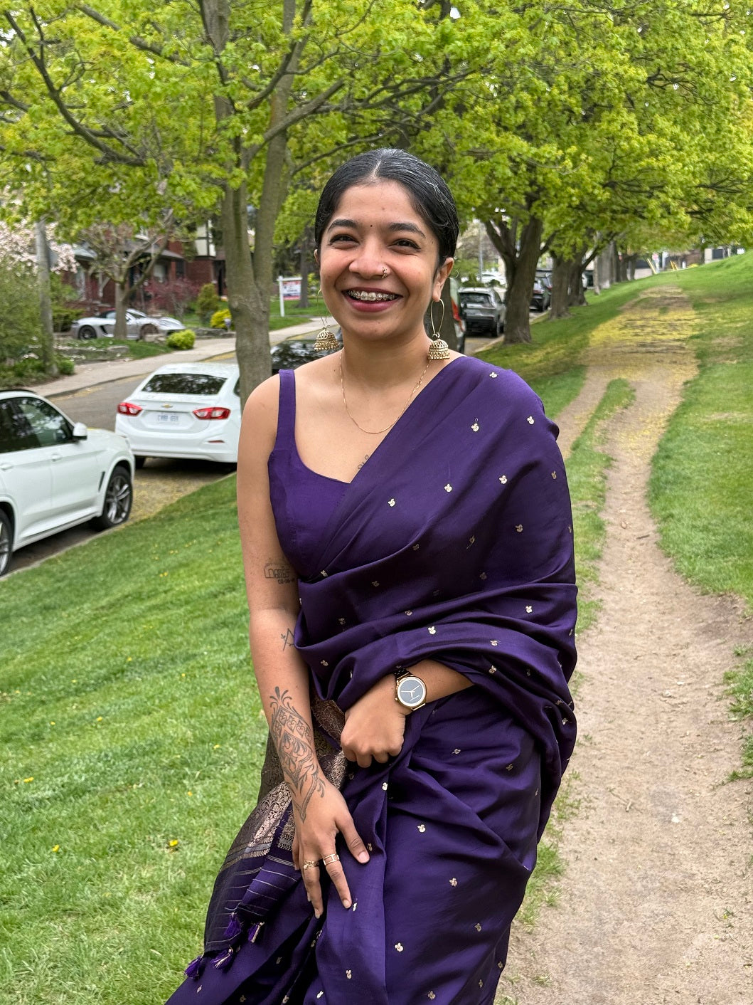 Woman smiling in a Deep Purple Mango Silk Saree, perfect for bridal and party wear – shop online now.