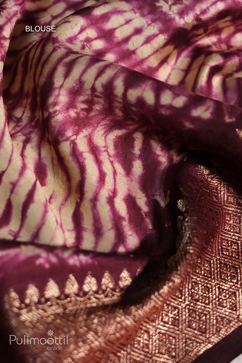 Close-up of contrast blouse fabric in maroon and beige tie-dye pattern with intricate Banarasi thread border, part of the Ecru beige Chiniya Banarasi silk saree set
