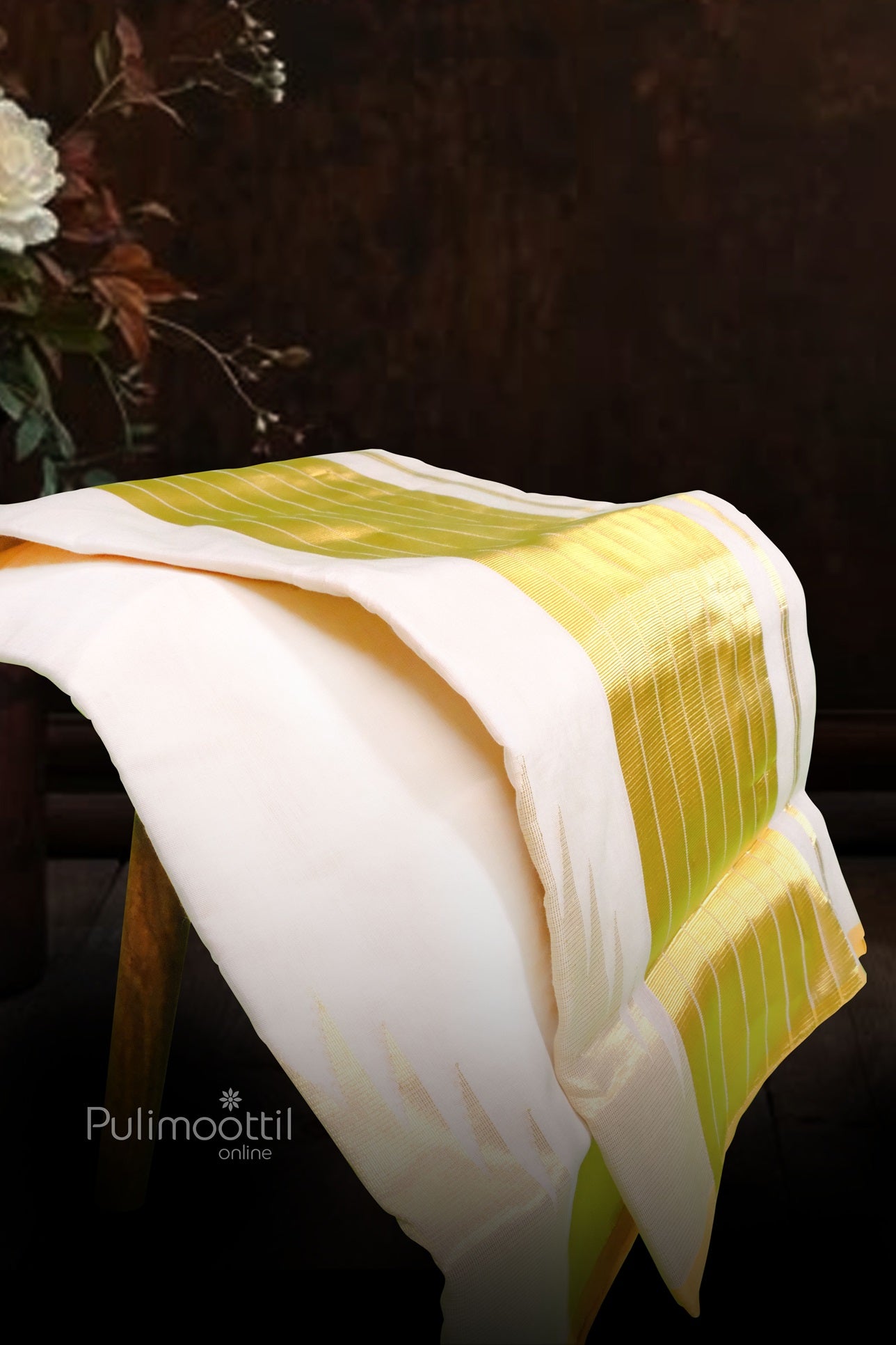 Close-up of golden kasavu horizontal lines on handwoven Kerala cotton fabric with fine texture