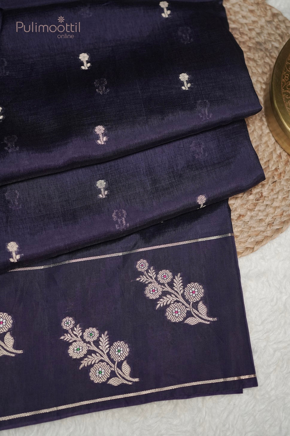 Shoulder close-up of dark violet Chiniya silk saree with golden floral buttas, highlighting the luxurious texture for party wear or bridal saree.