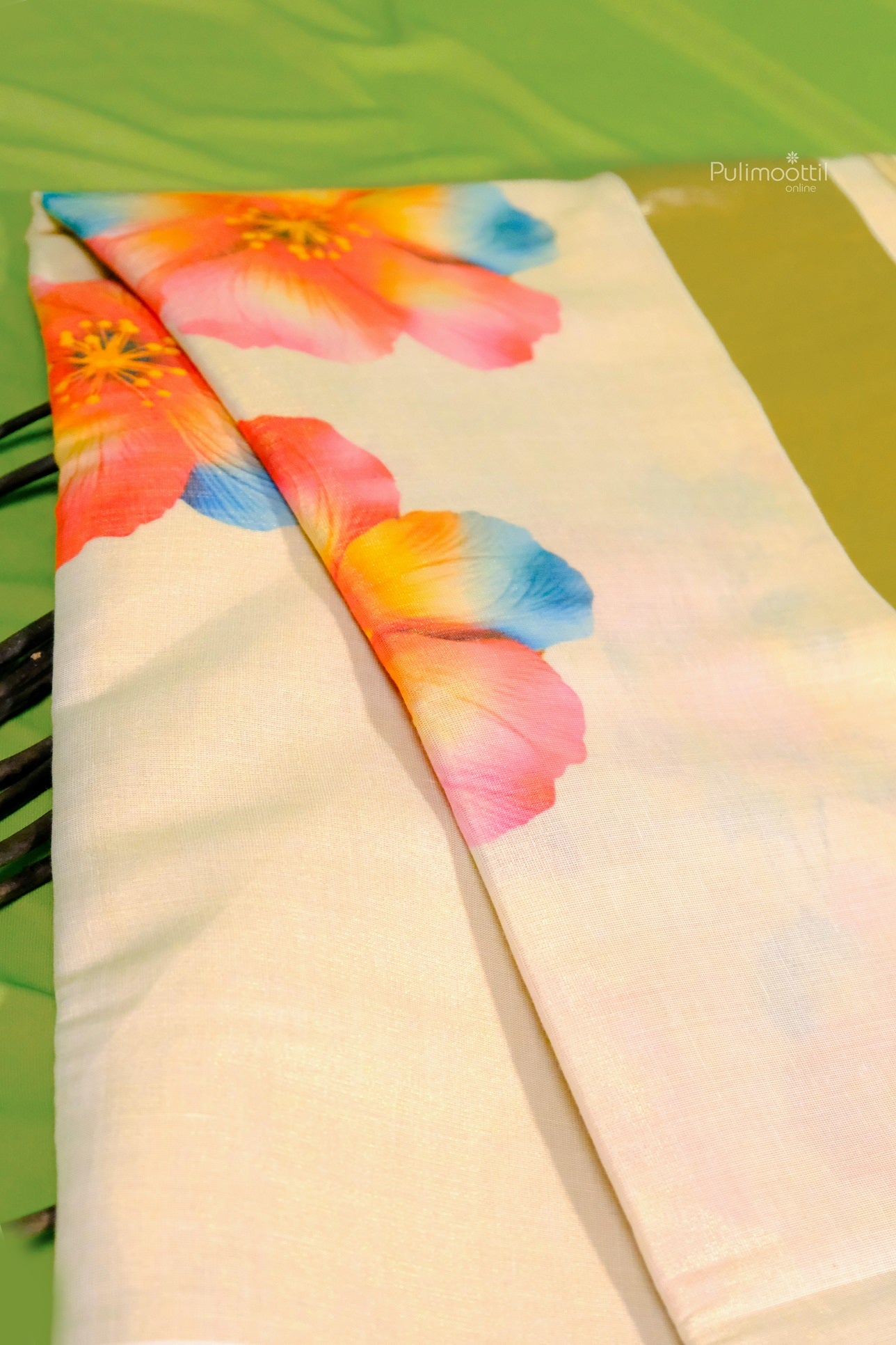 Elegant Kerala tissue saree with golden border and multicolor floral print on cream base