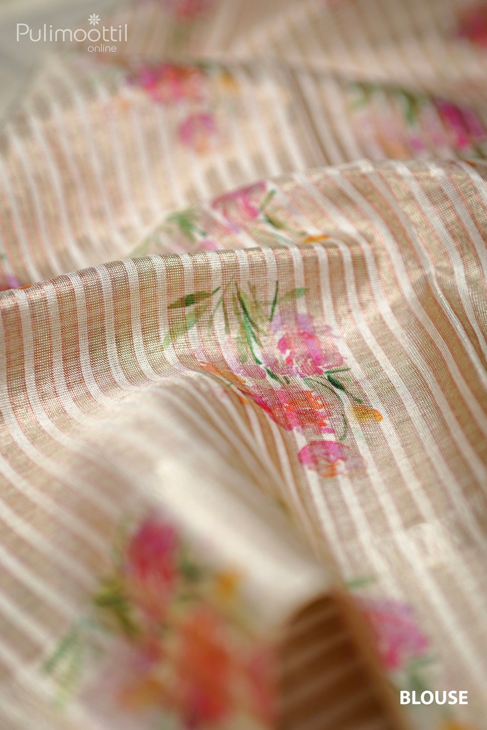 Cream tissue saree blouse fabric with vertical stripes and multicolour floral print in pink and orange shades.