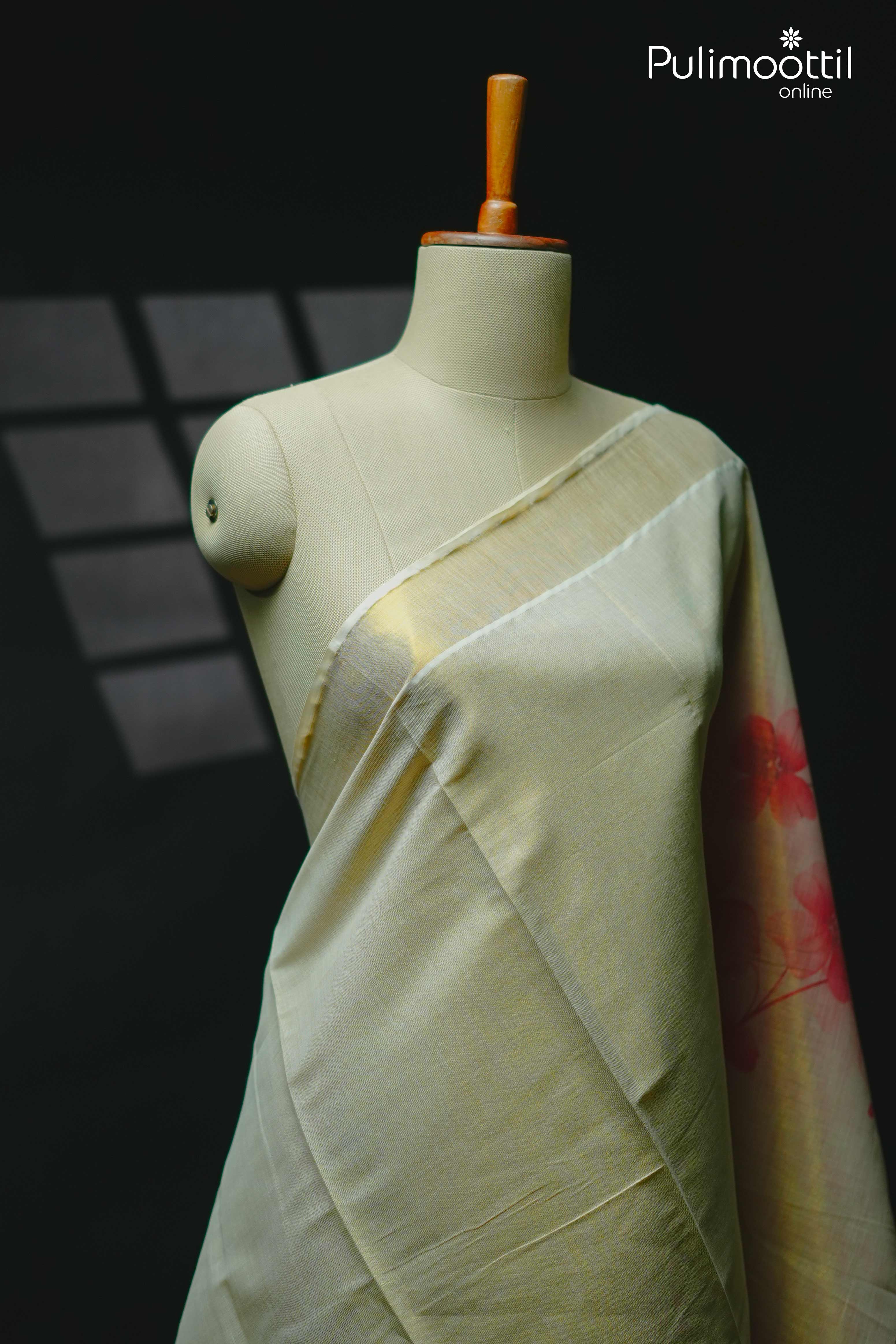 Golden tissue floral printed saree draped on mannequin under soft light – Pulimoottil Silks