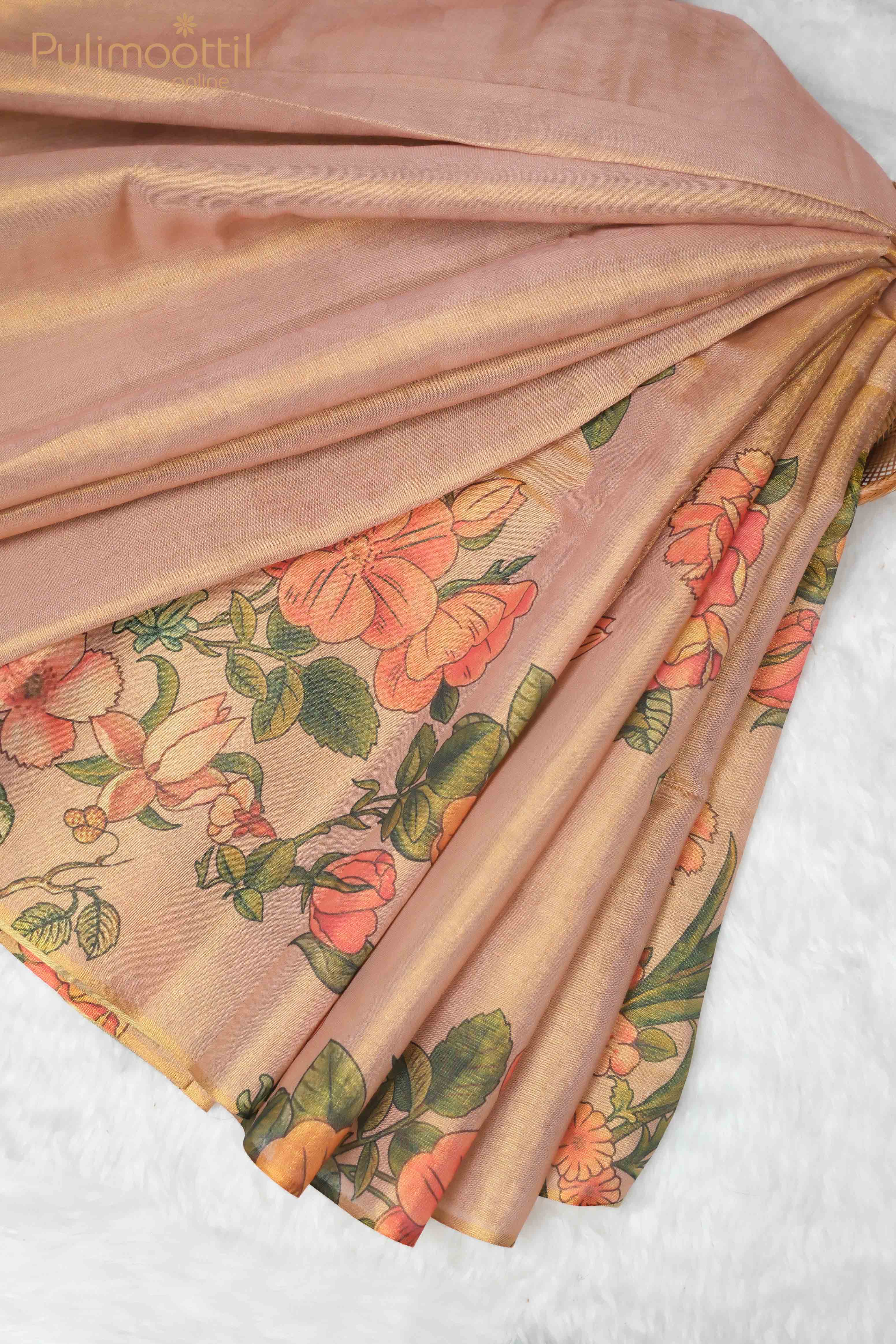 Golden Tissue Onam Kerala Traditional Set Saree with floral digital print featuring vibrant orange and pink flowers, draped elegantly to show the design, with no border. The soft, pastel fabric creates a smooth texture, highlighting the detailed print on one side.