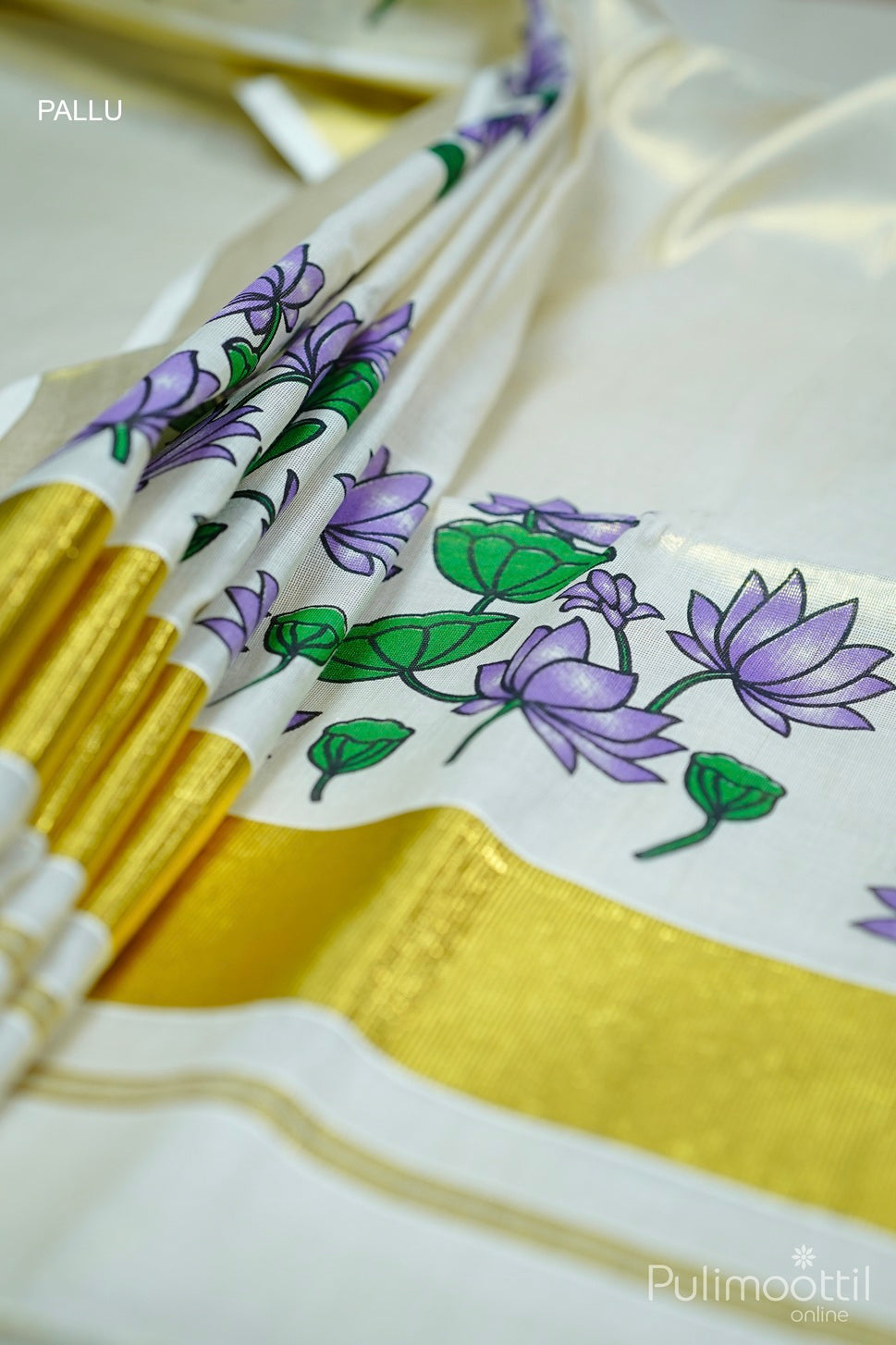 Golden tissue Kerala set saree with purple floral print and elegant golden border detail