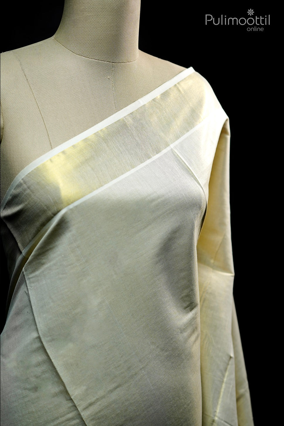 olden tissue Kerala set saree draped on mannequin, showcasing plain body with elegant tissue border on upper portion