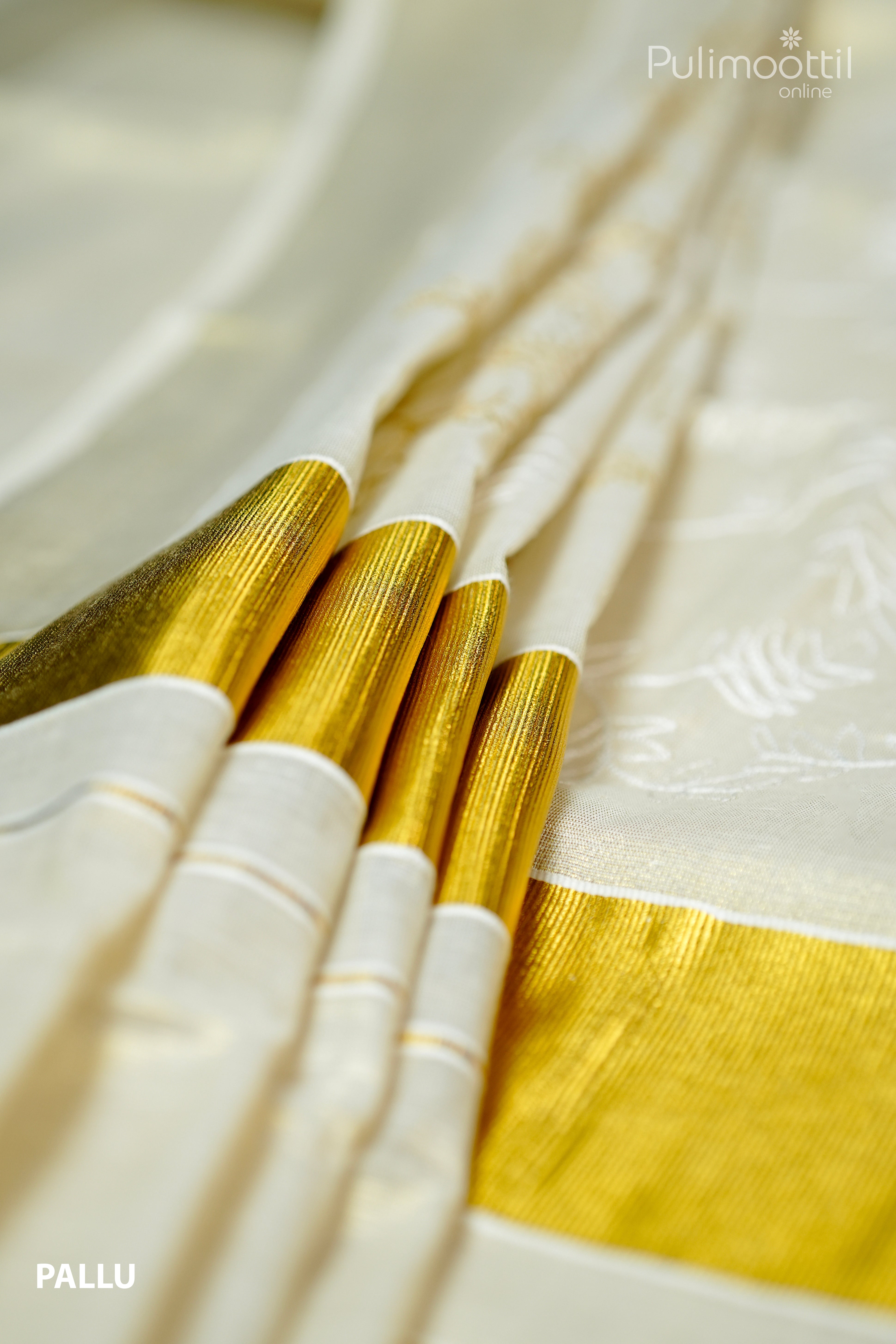 Golden tissue Kerala saree pallu with broad shimmering golden border and subtle woven design