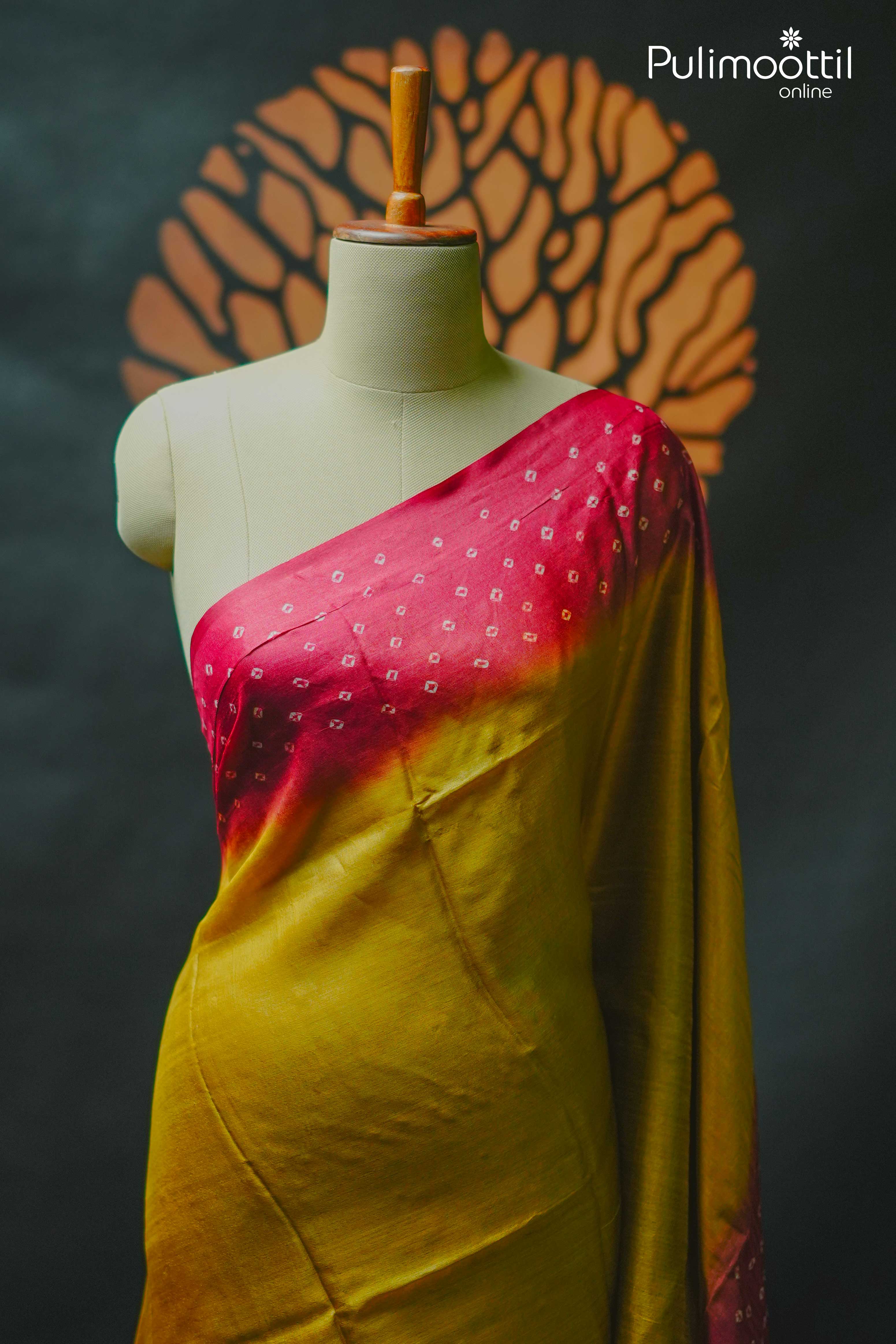 Golden yellow Tussar silk saree with plain body and red Chungidi-style pallu draped on mannequin, perfect for festive occasions like Onam