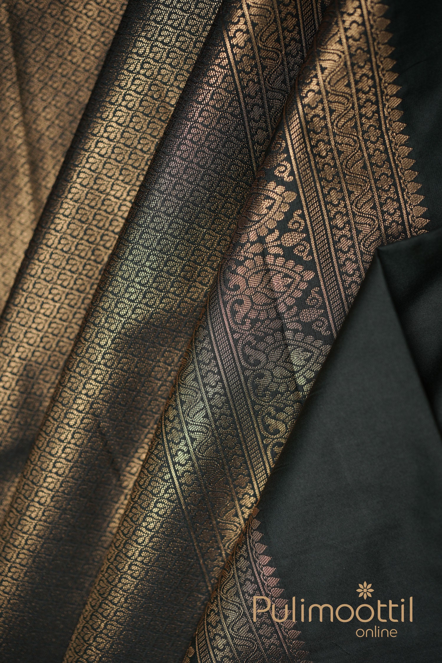 Elegant black and gold silk saree featuring a rich design with gold patterns, ideal for formal events.