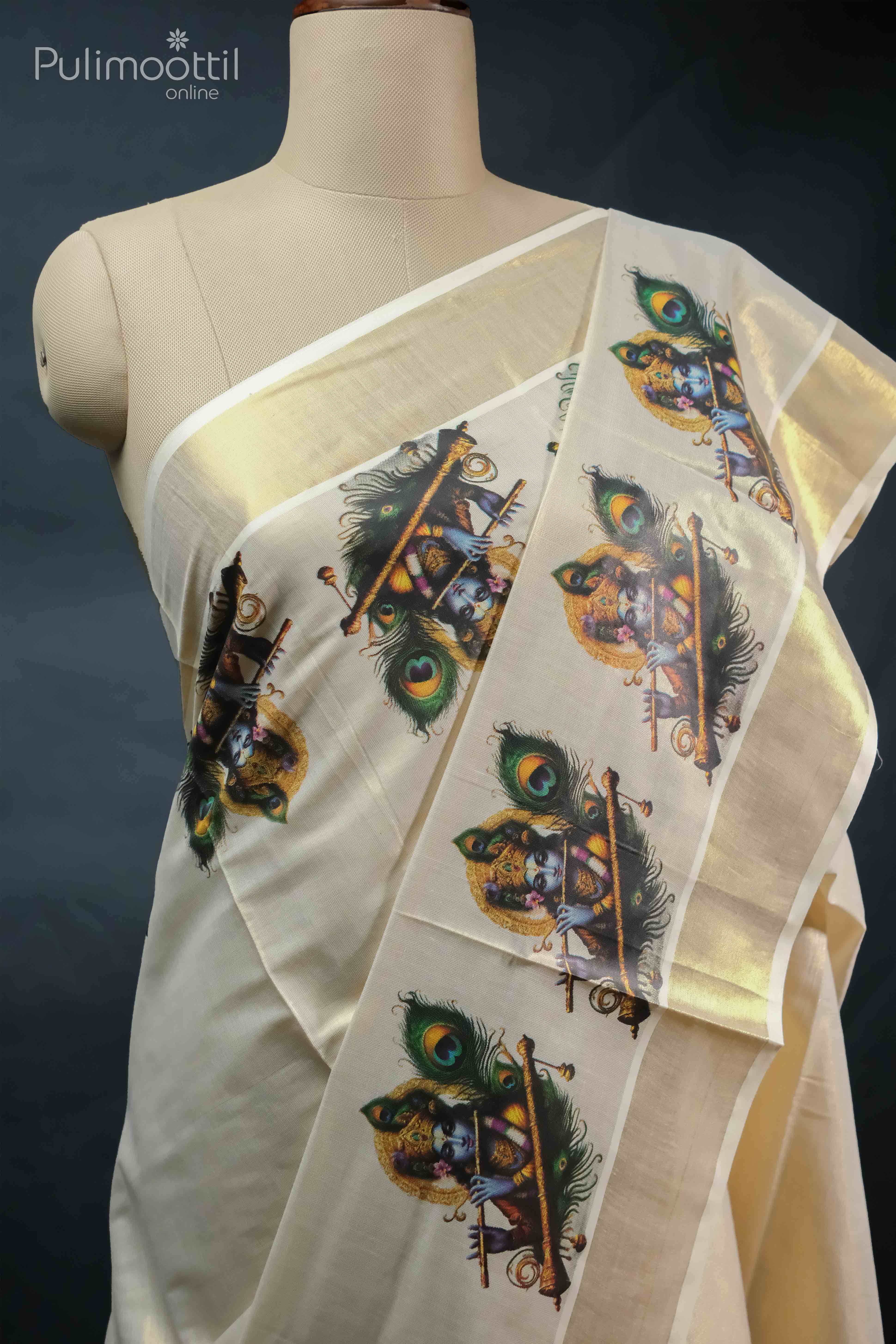 Golden tissue Kerala saree with Krishna design print and peacock feather motifs, draped on mannequin showing traditional style with shimmering golden kasavu border.