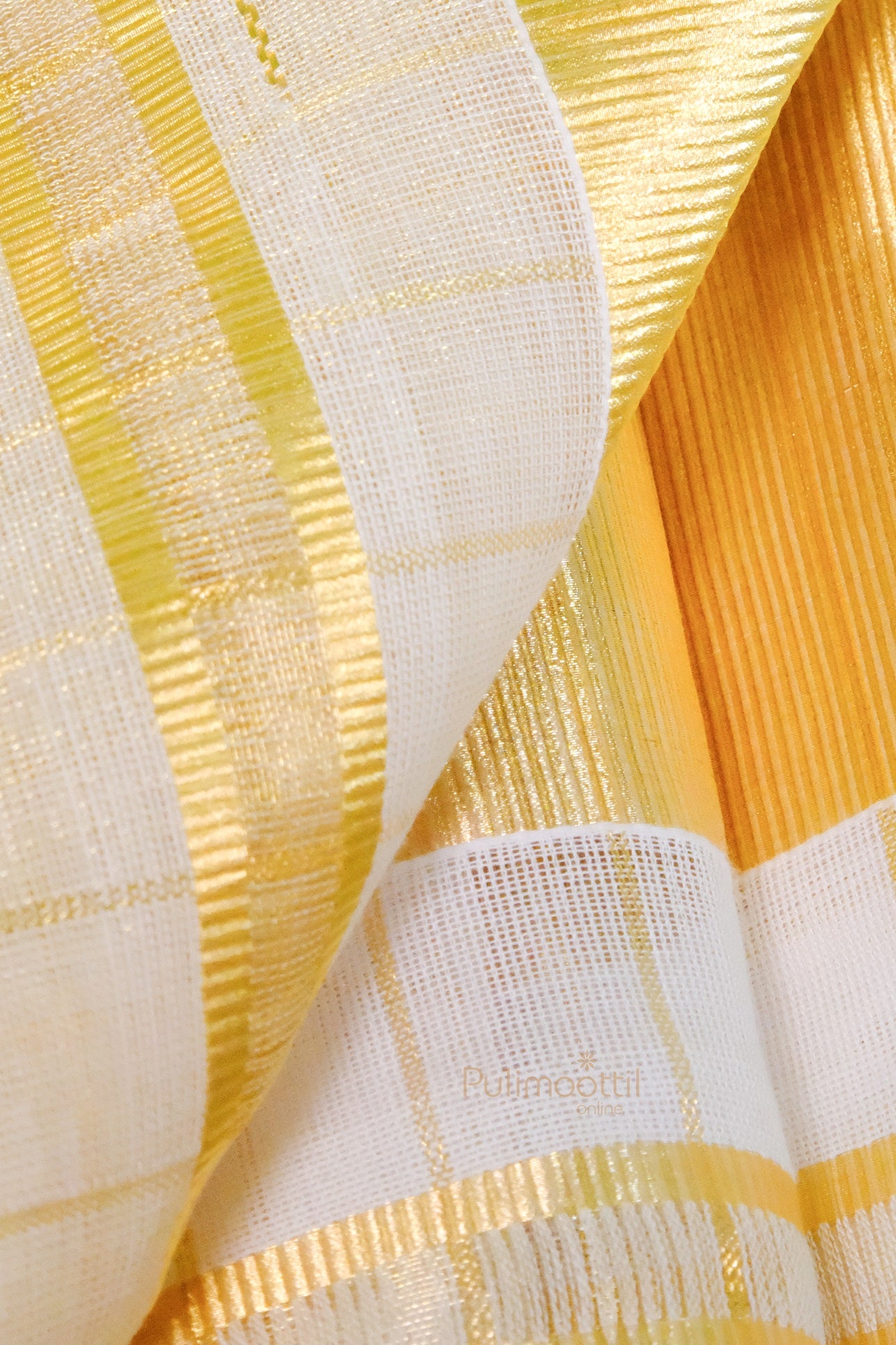 Close-up of golden kasavu border and checkered pattern on Kerala mundu, showcasing rich fabric texture