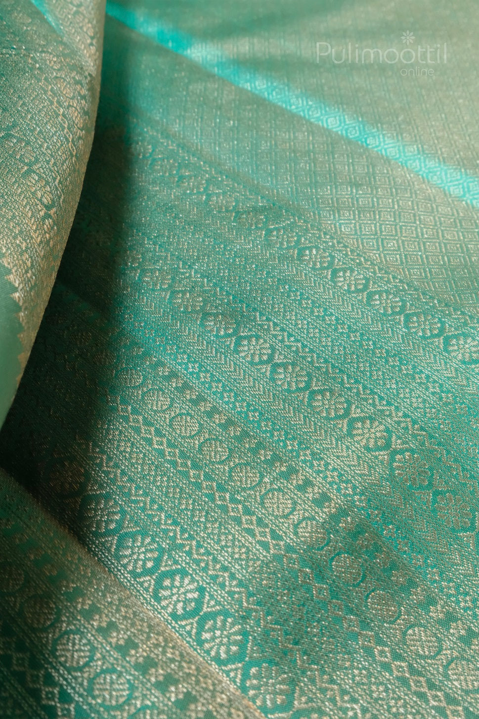 ivory cream Kanchipuram brocade saree body with light gold floral motifs and jungle green brocade border